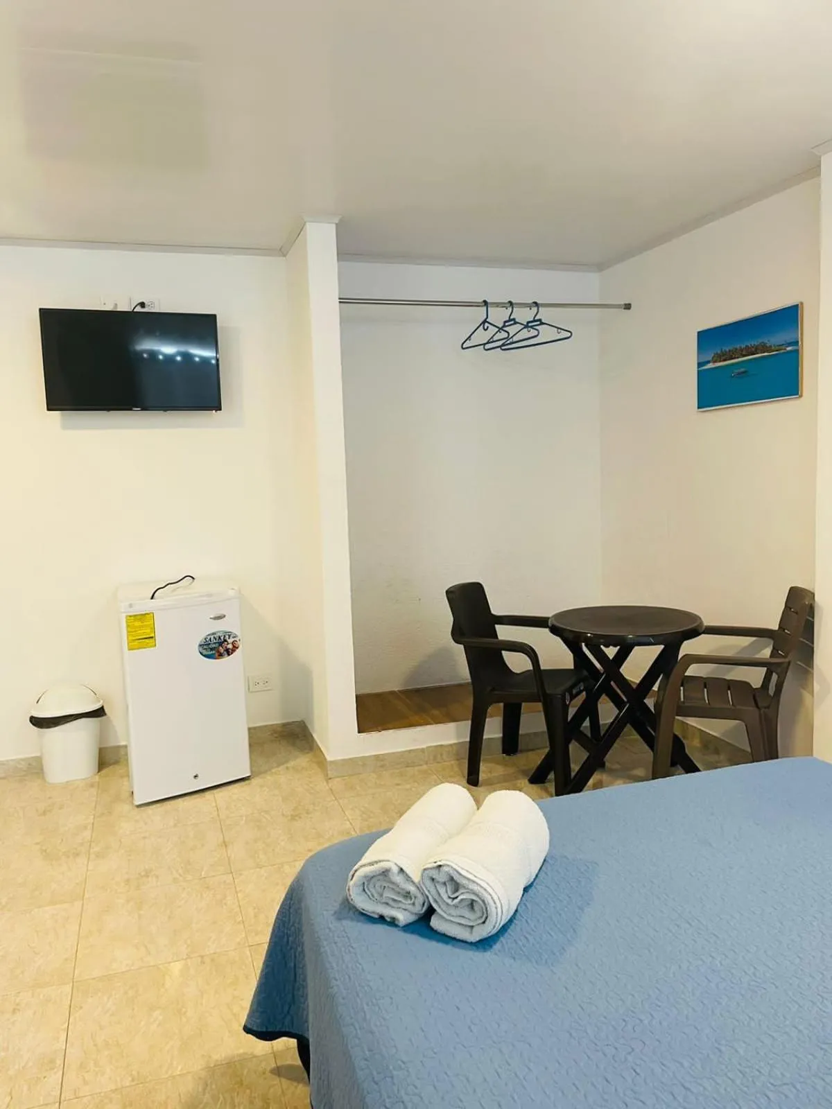 Bed in BLUE ISLAND HOTEL