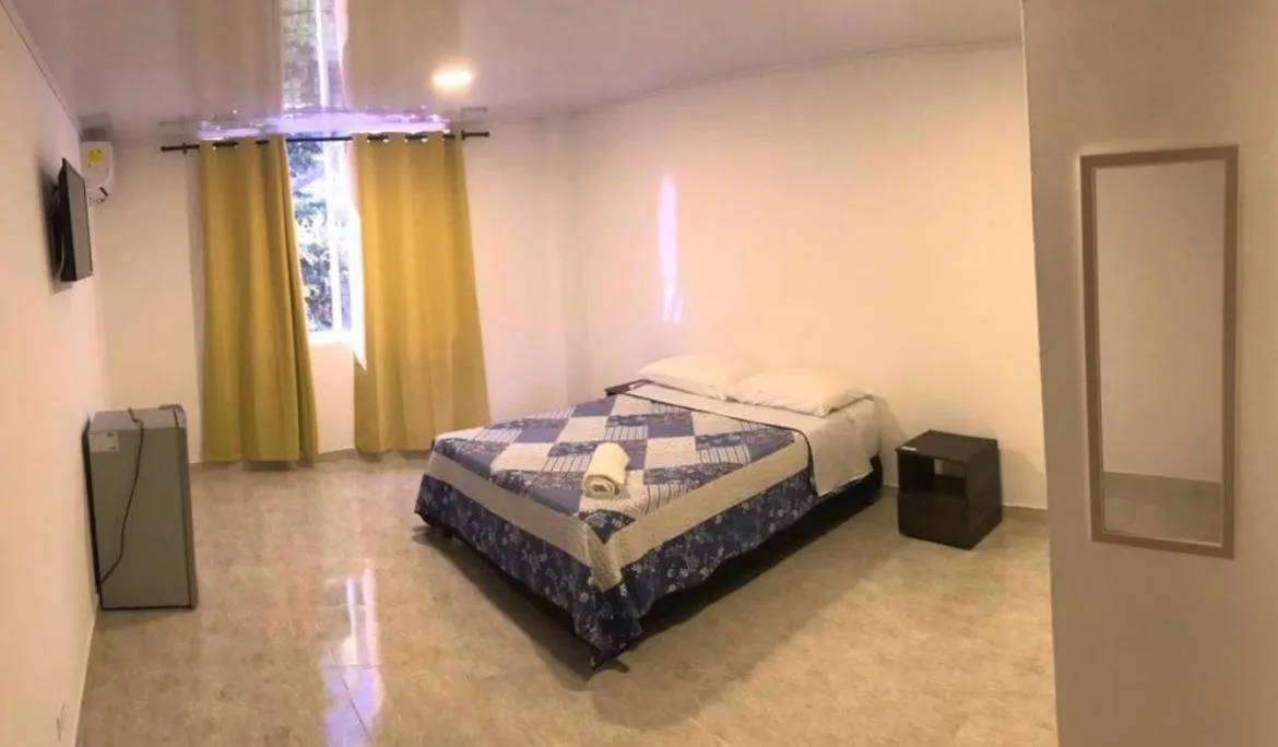 Bed in BLUE ISLAND HOTEL