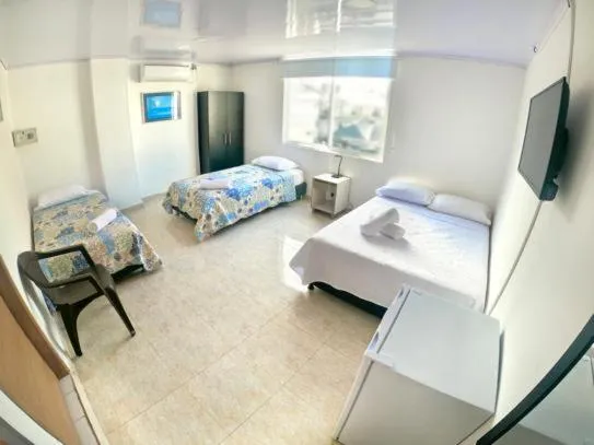 Bed in BLUE ISLAND HOTEL