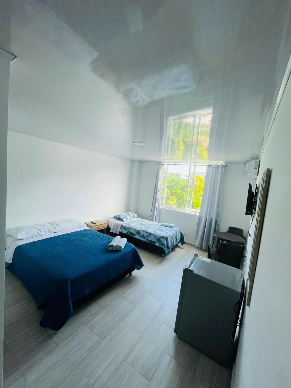 Bed in BLUE ISLAND HOTEL