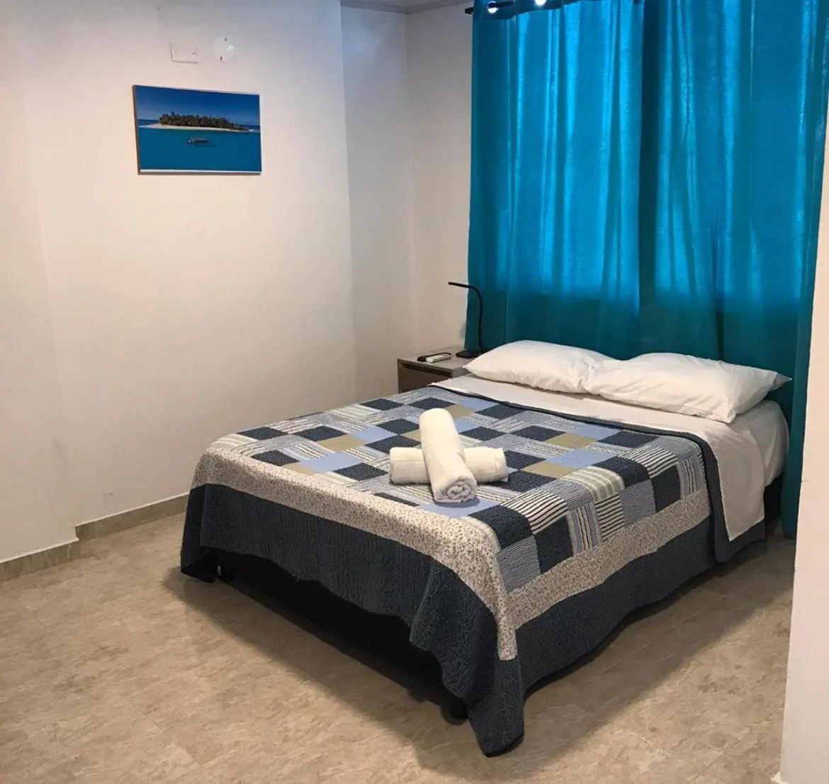 Bed in BLUE ISLAND HOTEL