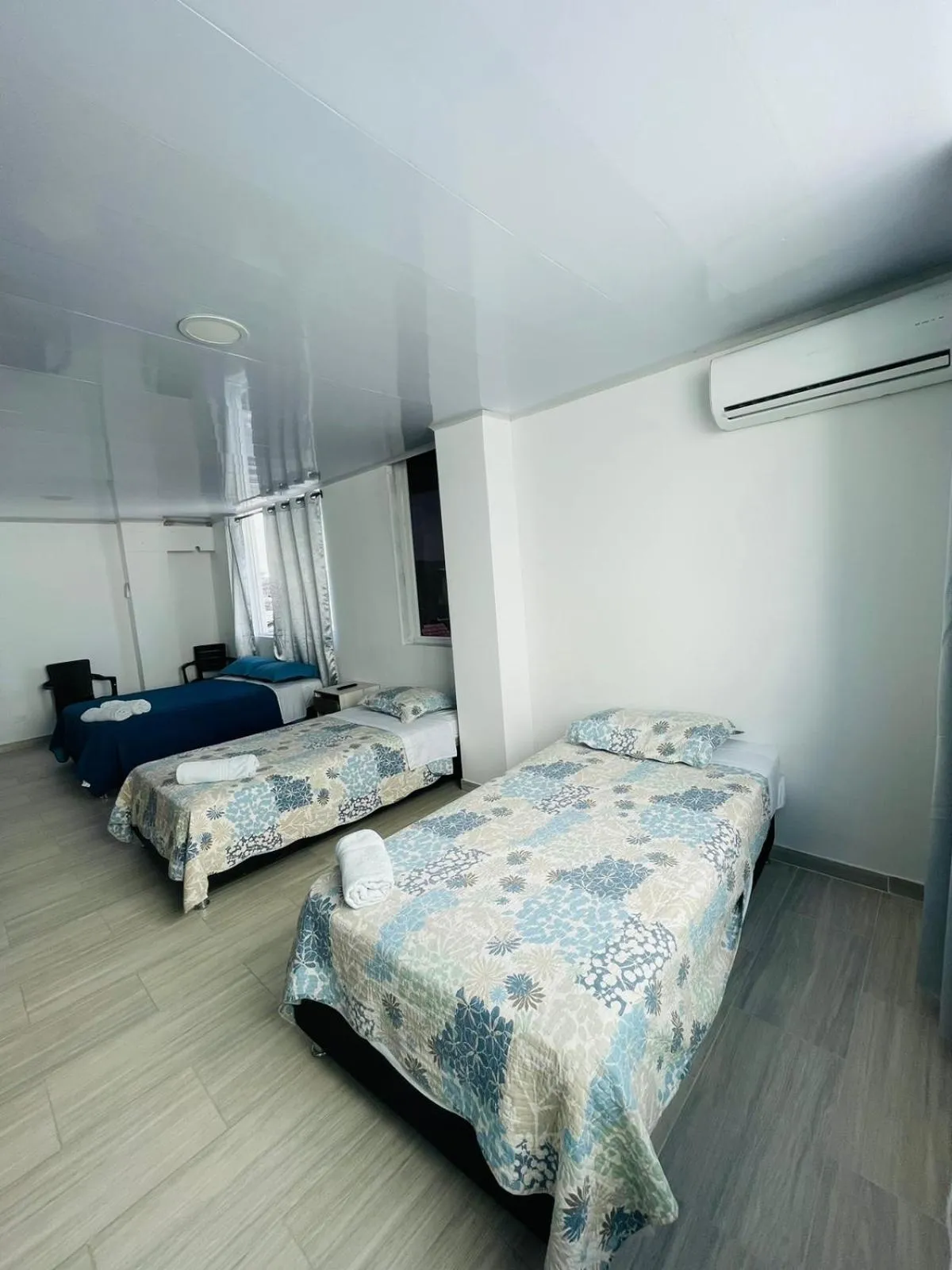 Bed in BLUE ISLAND HOTEL
