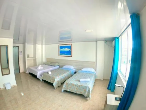 Bed in BLUE ISLAND HOTEL