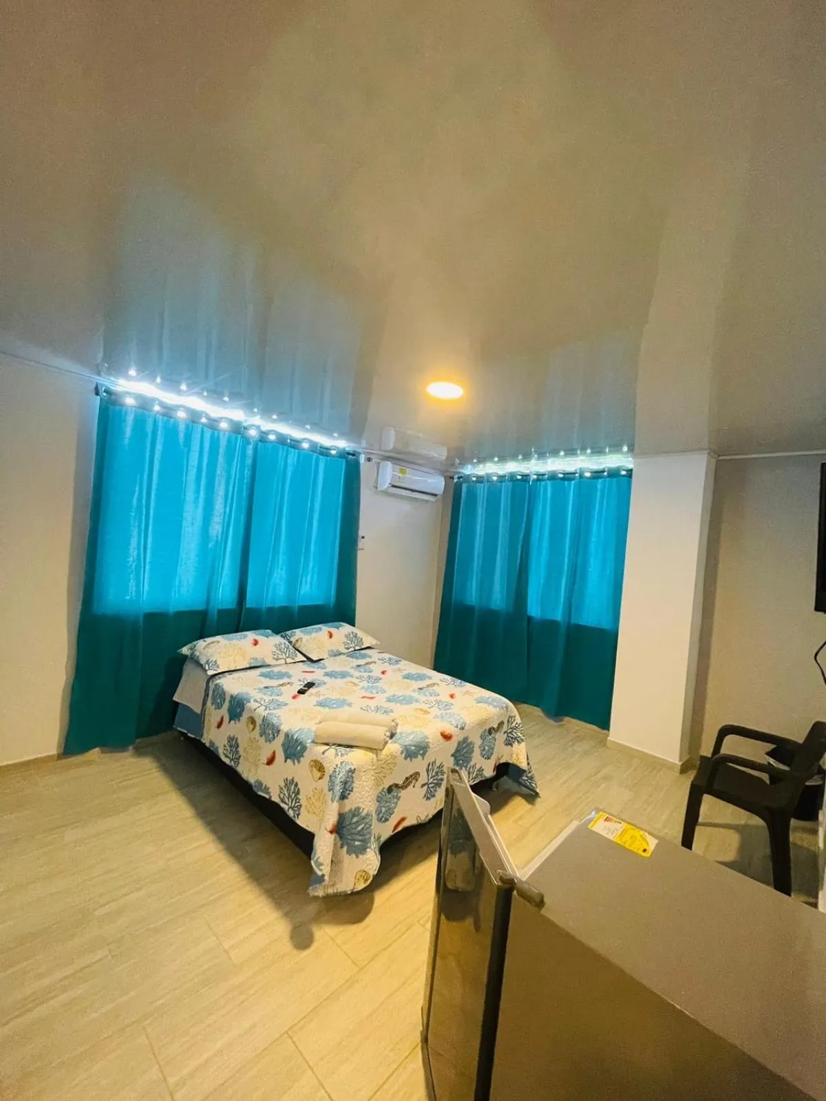 Bed in BLUE ISLAND HOTEL