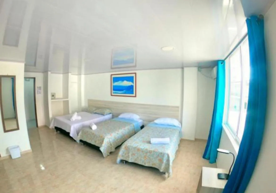 Bed in BLUE ISLAND HOTEL