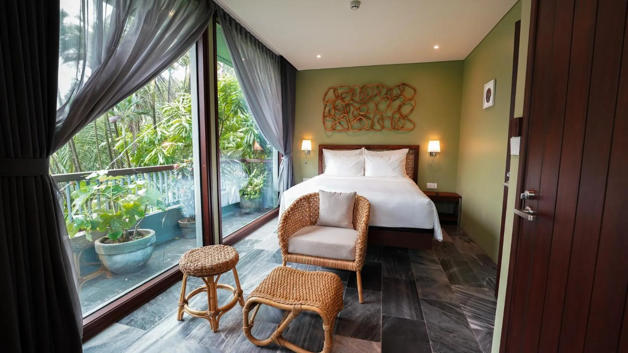 Seating area, Bed in CHiEM HoiAn - The Beachside Boutique Hotel & Villa