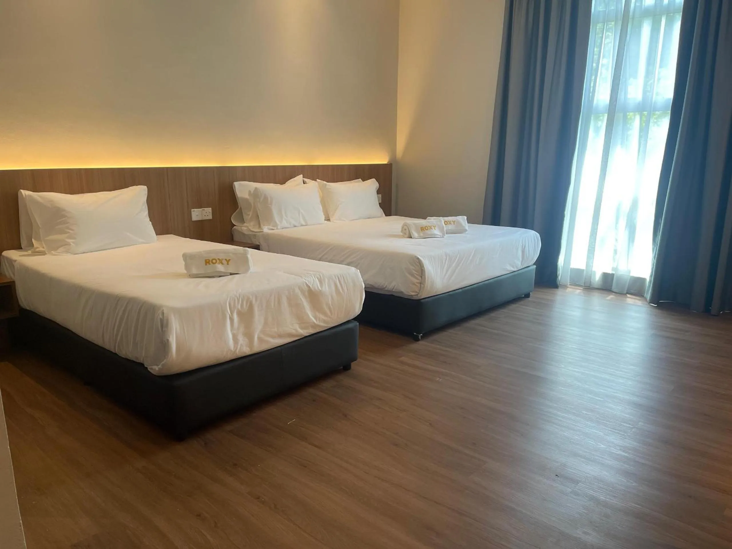 Bed in Roxy Hotel Aiman