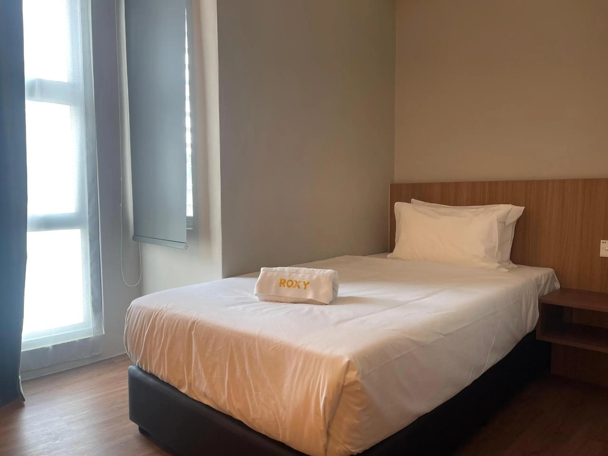 Bed in Roxy Hotel Aiman