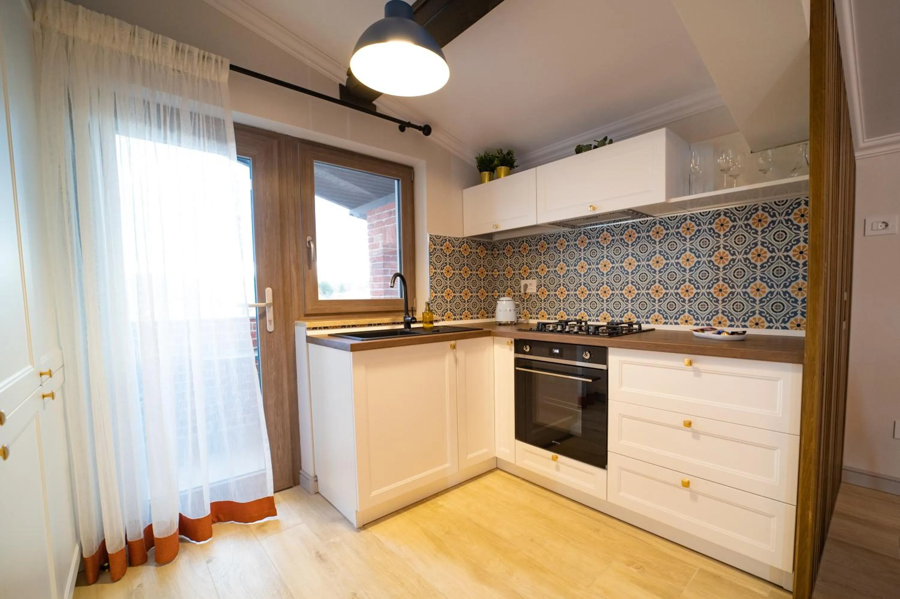 Kitchen or kitchenette in First Apartments