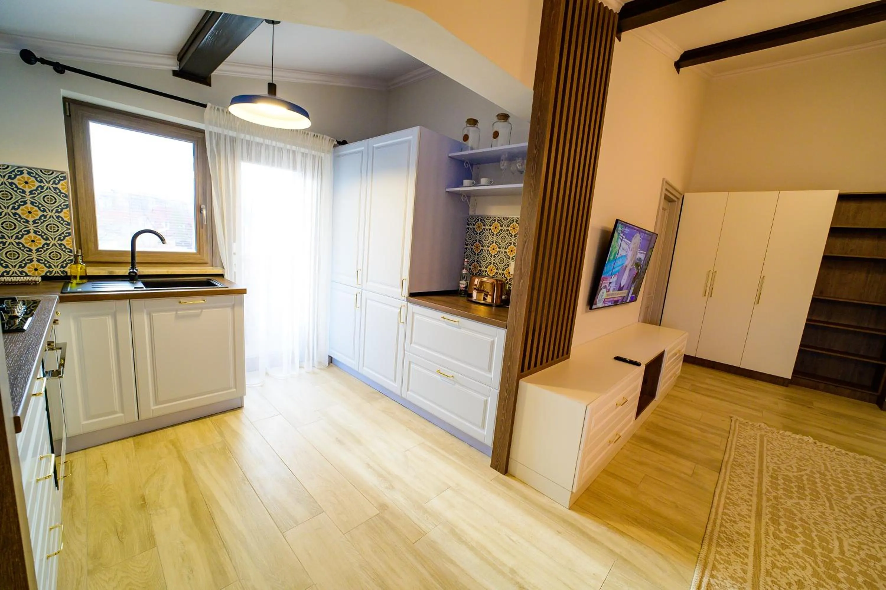 Kitchen or kitchenette in First Apartments