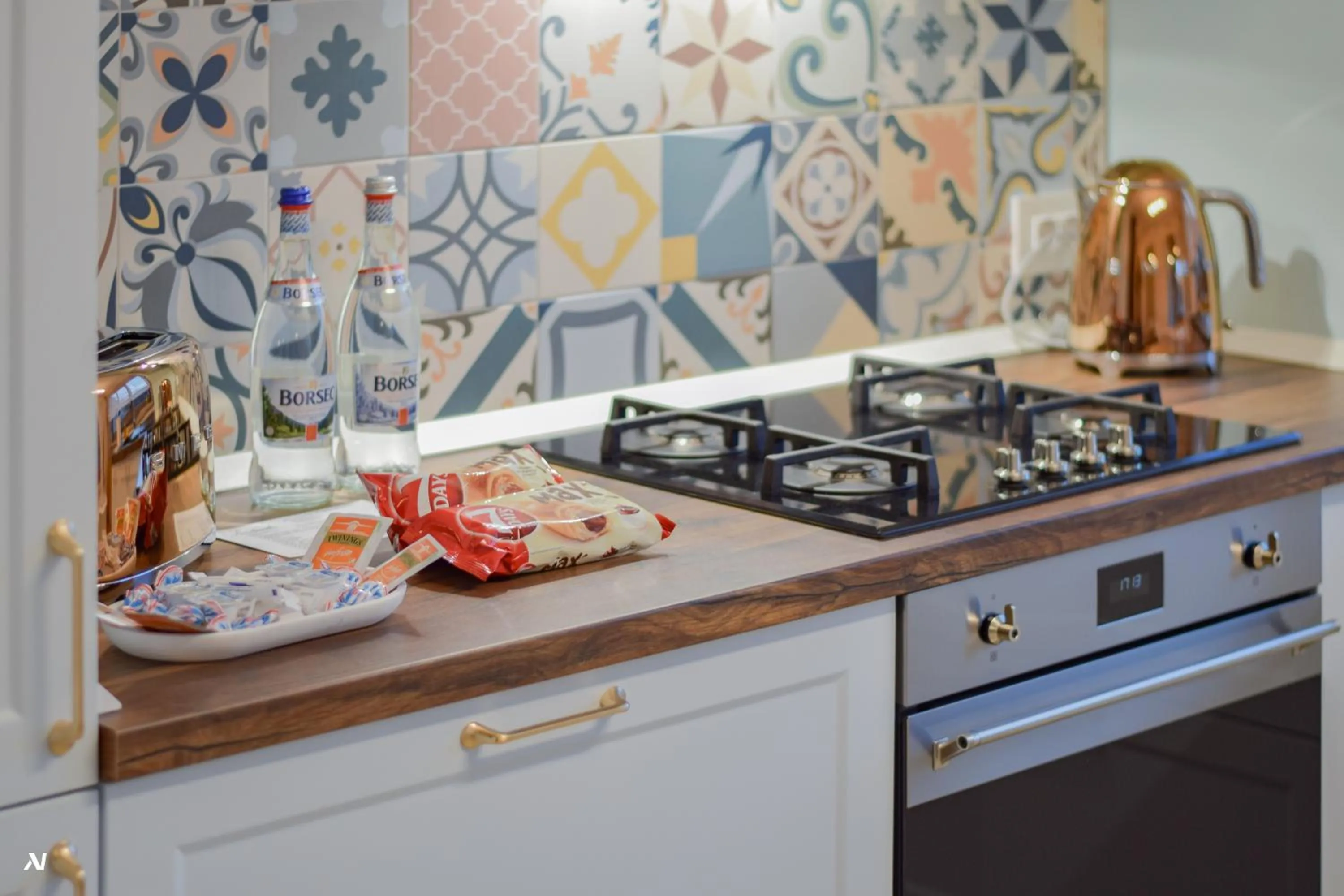 Kitchen or kitchenette in First Apartments