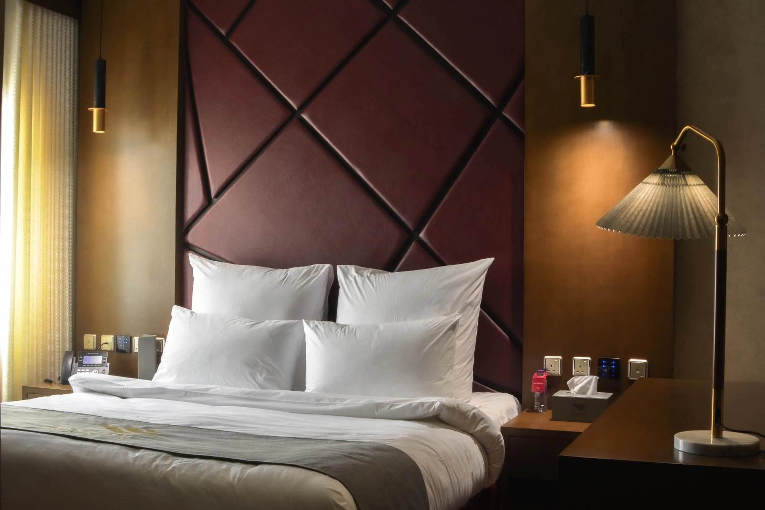 Bed in Redwaves Hotel