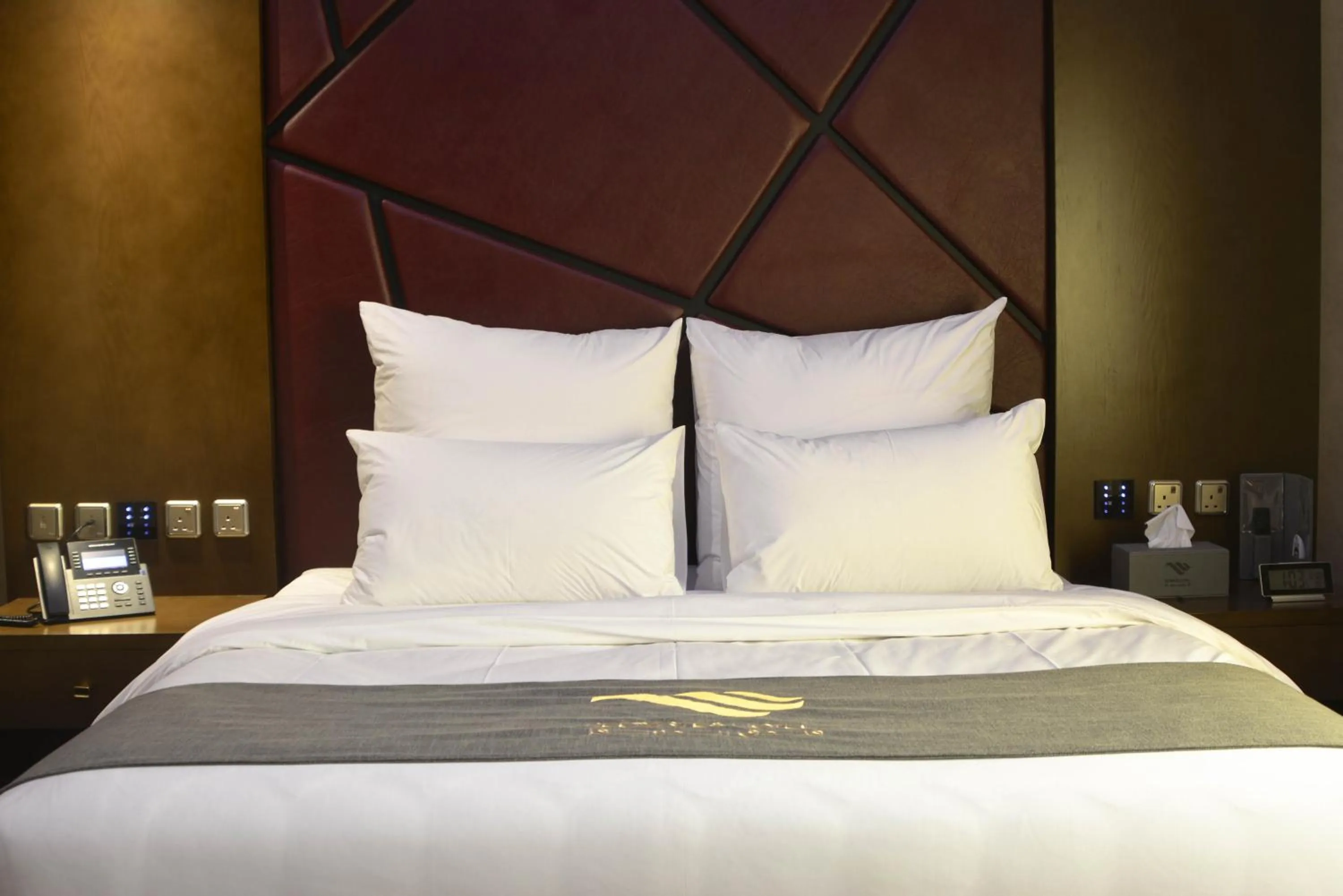 Bed in Redwaves Hotel