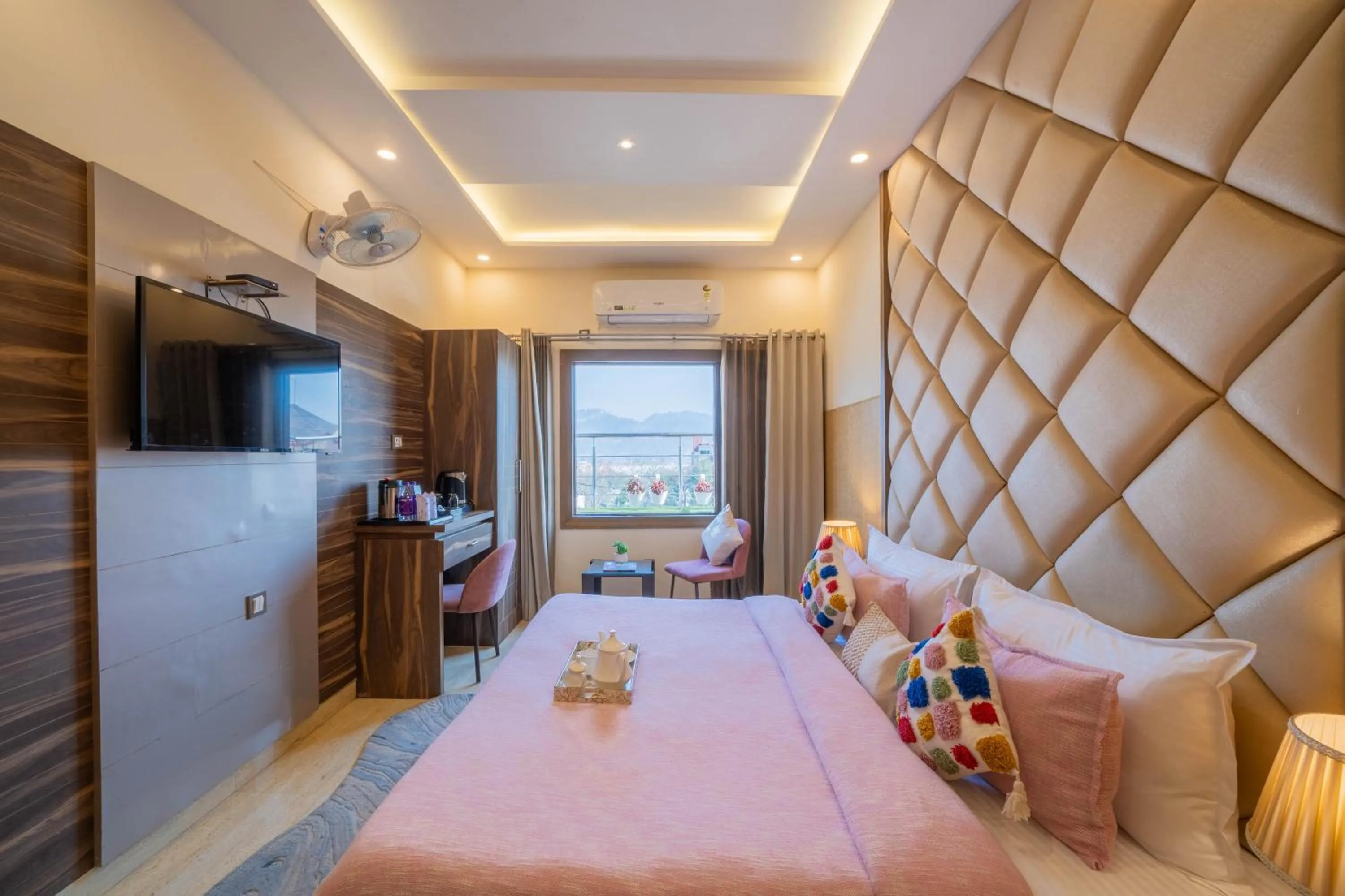 Seating area, Bed in Perfectstayz Premium at Harkipauri Road - Ganga view rooftop cafe