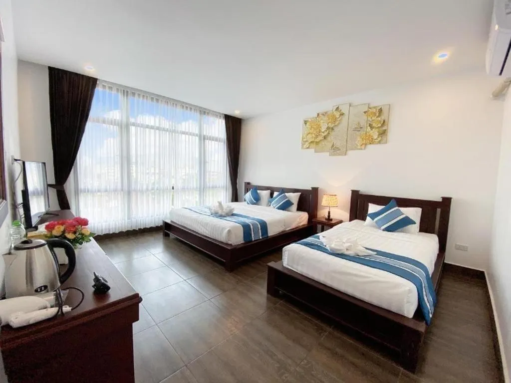 Bed in VANG VIENG TOPVIEW HOTEL