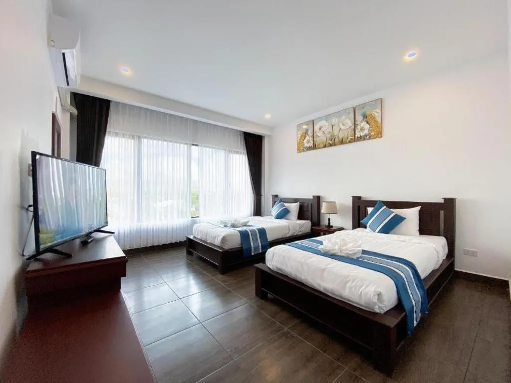 Bed in VANG VIENG TOPVIEW HOTEL