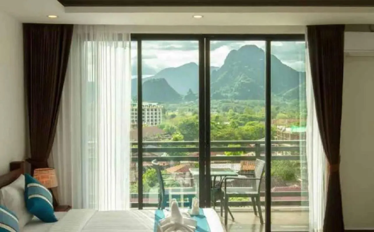 Bed in VANG VIENG TOPVIEW HOTEL