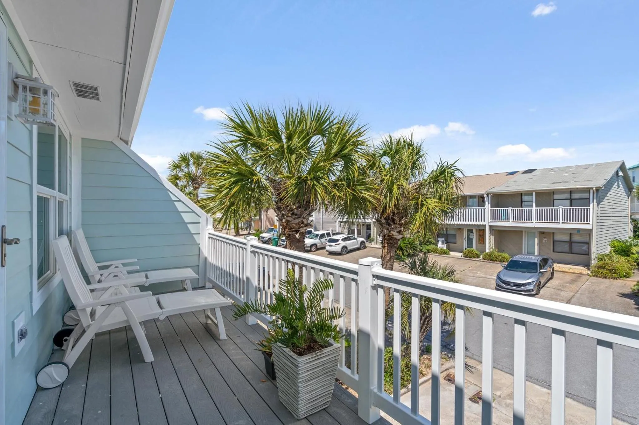 Balcony/Terrace in 140 Feet To White Sandy Beaches! Newly Renovated! Pool! Grill!