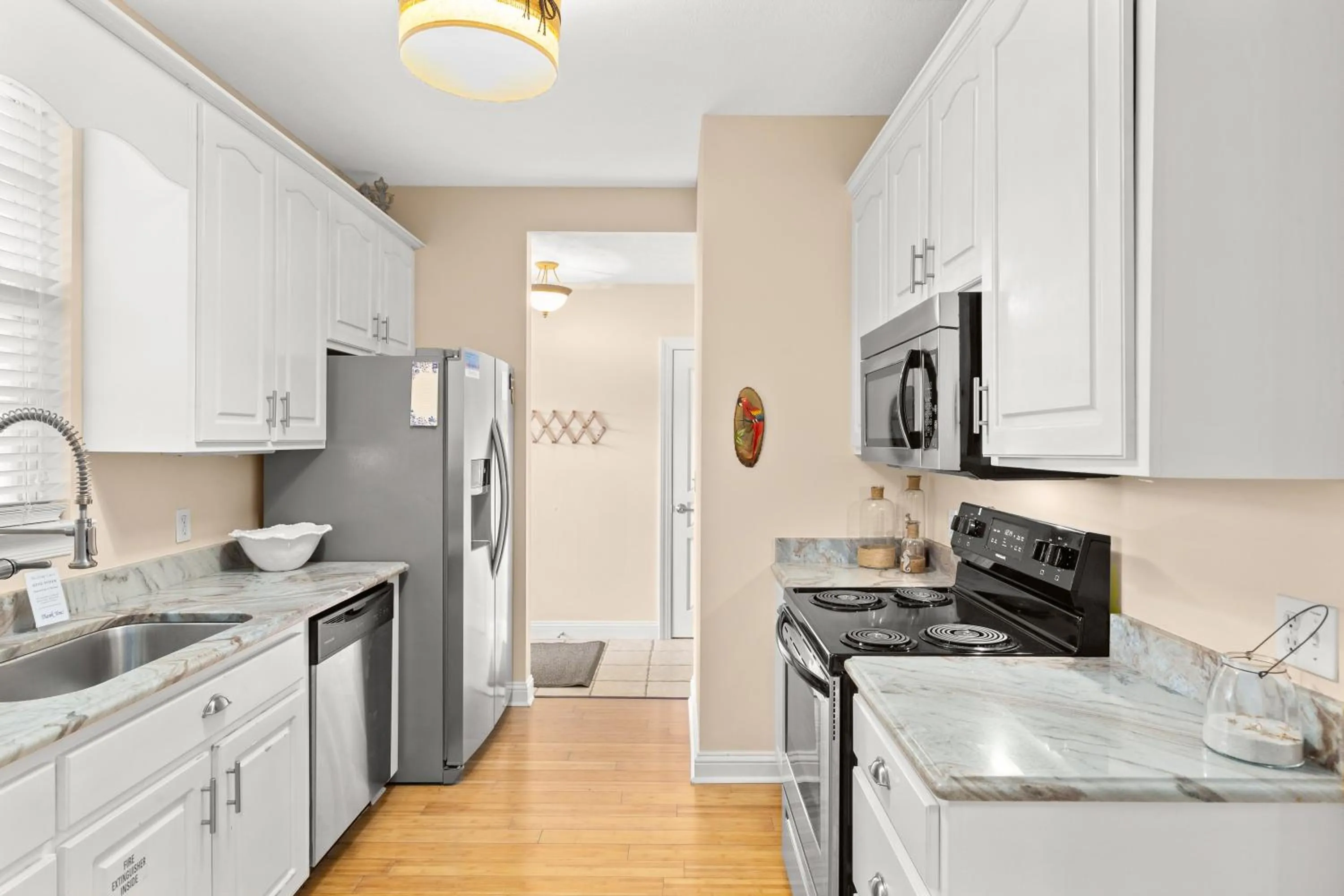 Kitchen or kitchenette in Expertly Decorated Family Home, Steps to Beach w/ a Private Heated Pool & Spa!