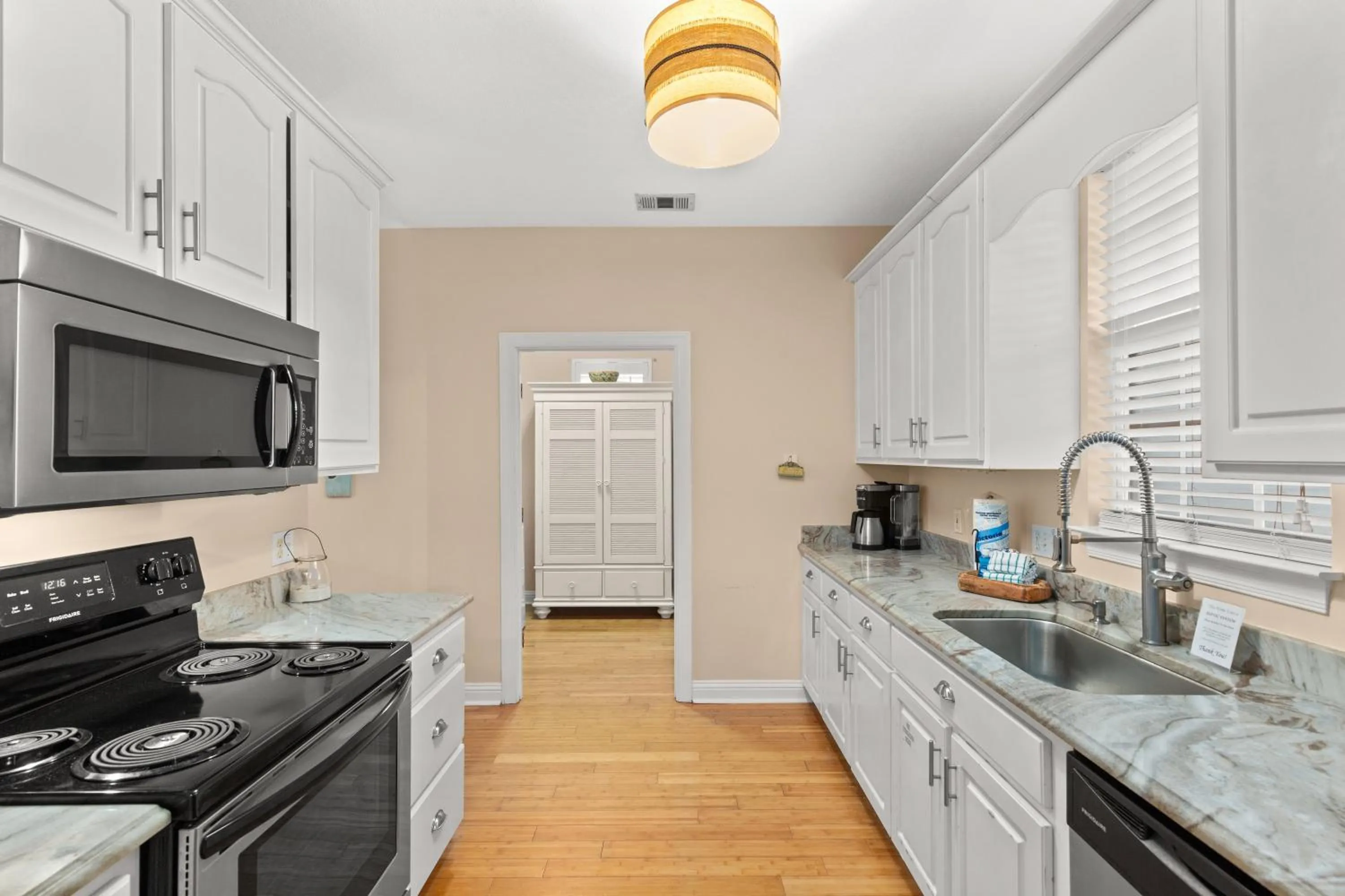 Kitchen or kitchenette in Expertly Decorated Family Home, Steps to Beach w/ a Private Heated Pool & Spa!