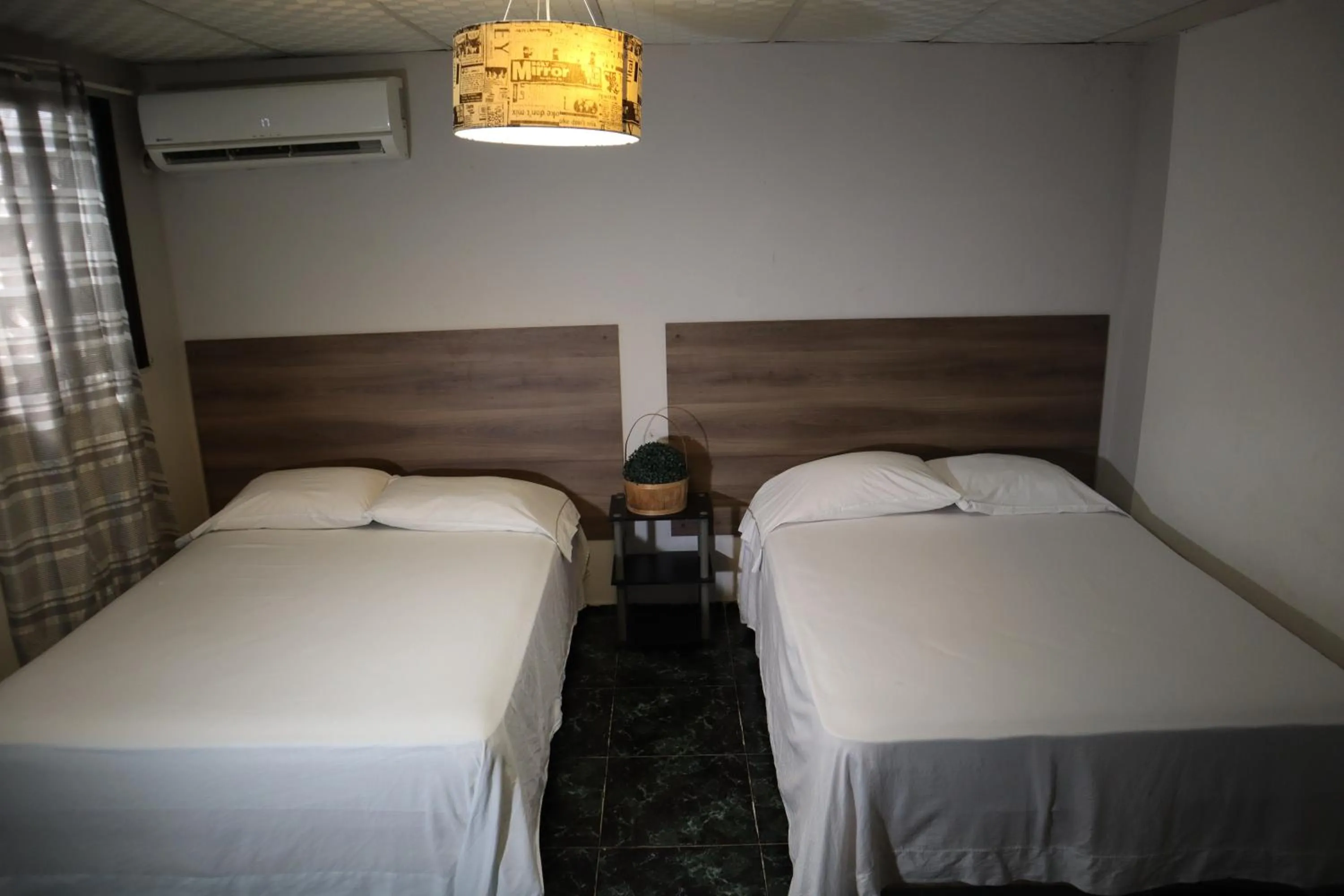 Bed in Pacific Coast Hotel