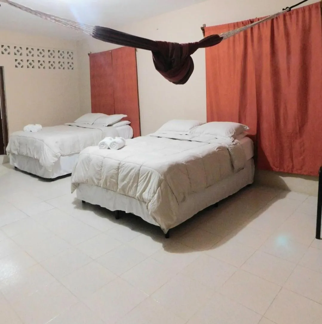 Bed in Arnold's Guest House