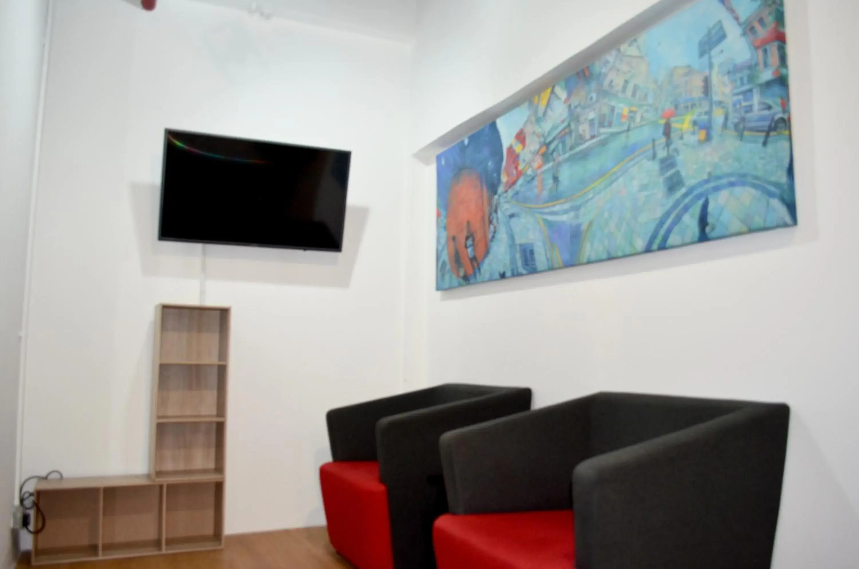 Communal lounge/ TV room in RED ROOM Kuala Lumpur Communal lounge/ TV room in RED ROOM Kuala Lumpur