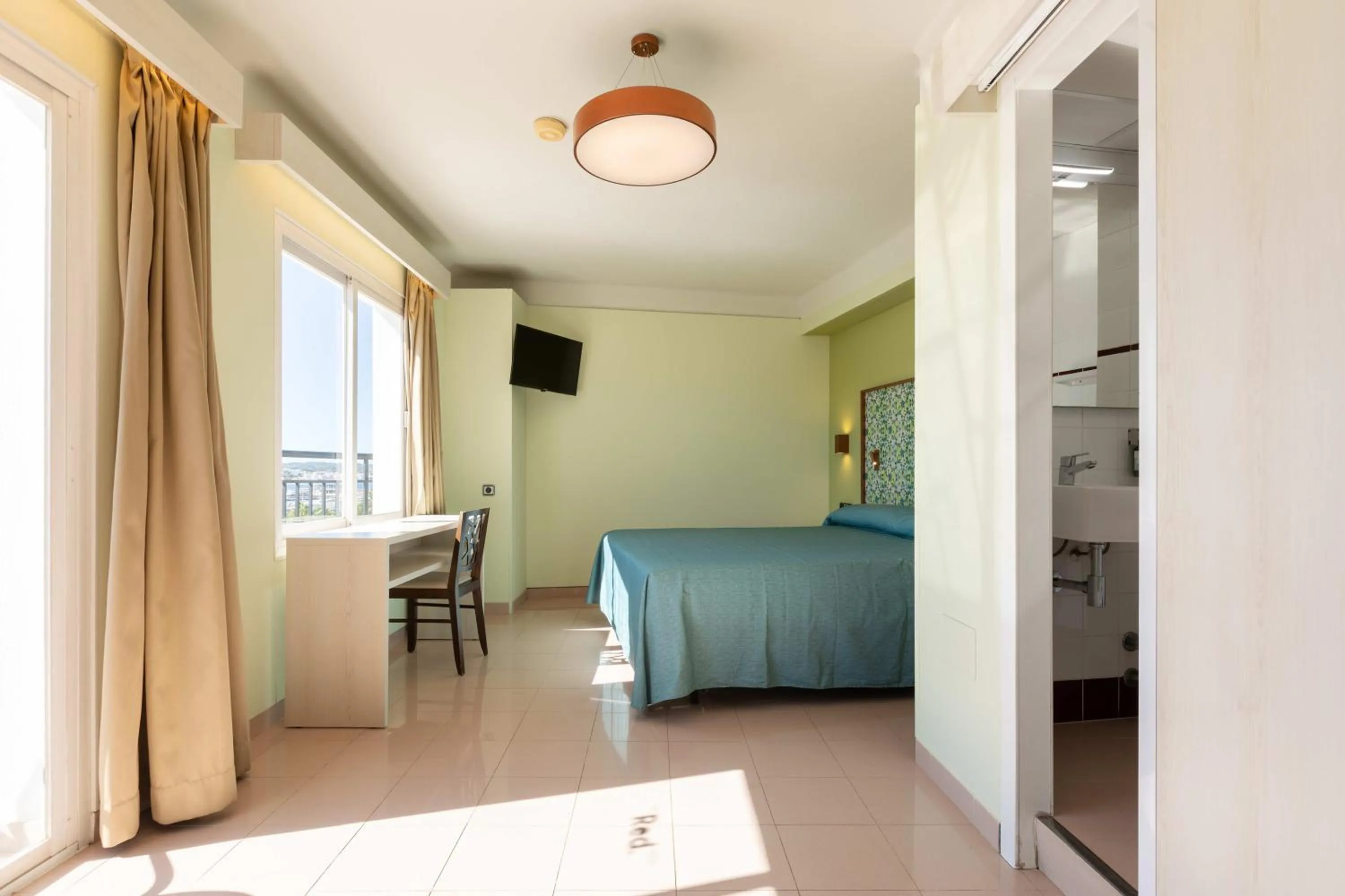 Communal lounge/ TV room in The Red Hotel - Adults Only