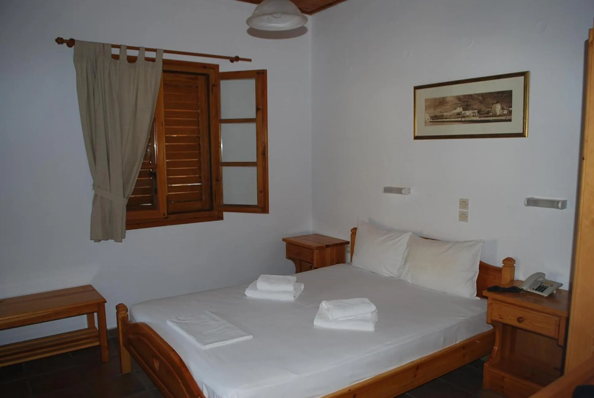 Bed in Siroco's Rooms And Studios