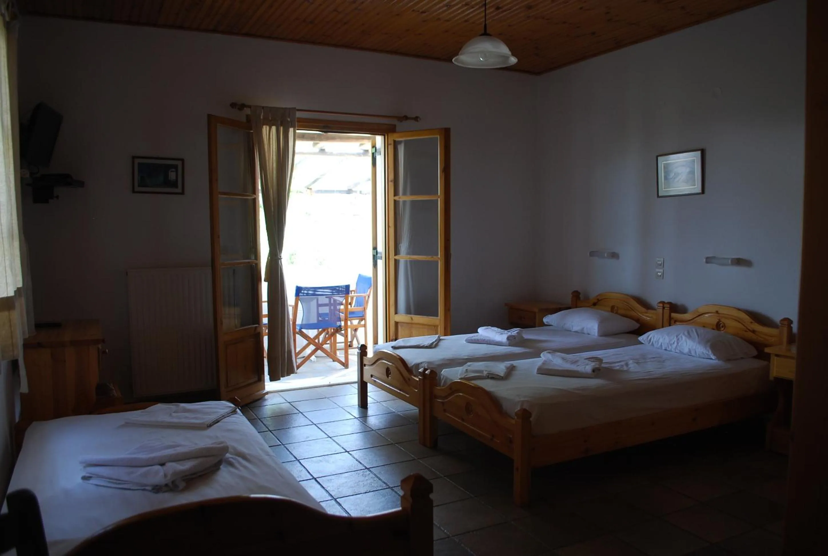 Bed in Siroco's Rooms And Studios