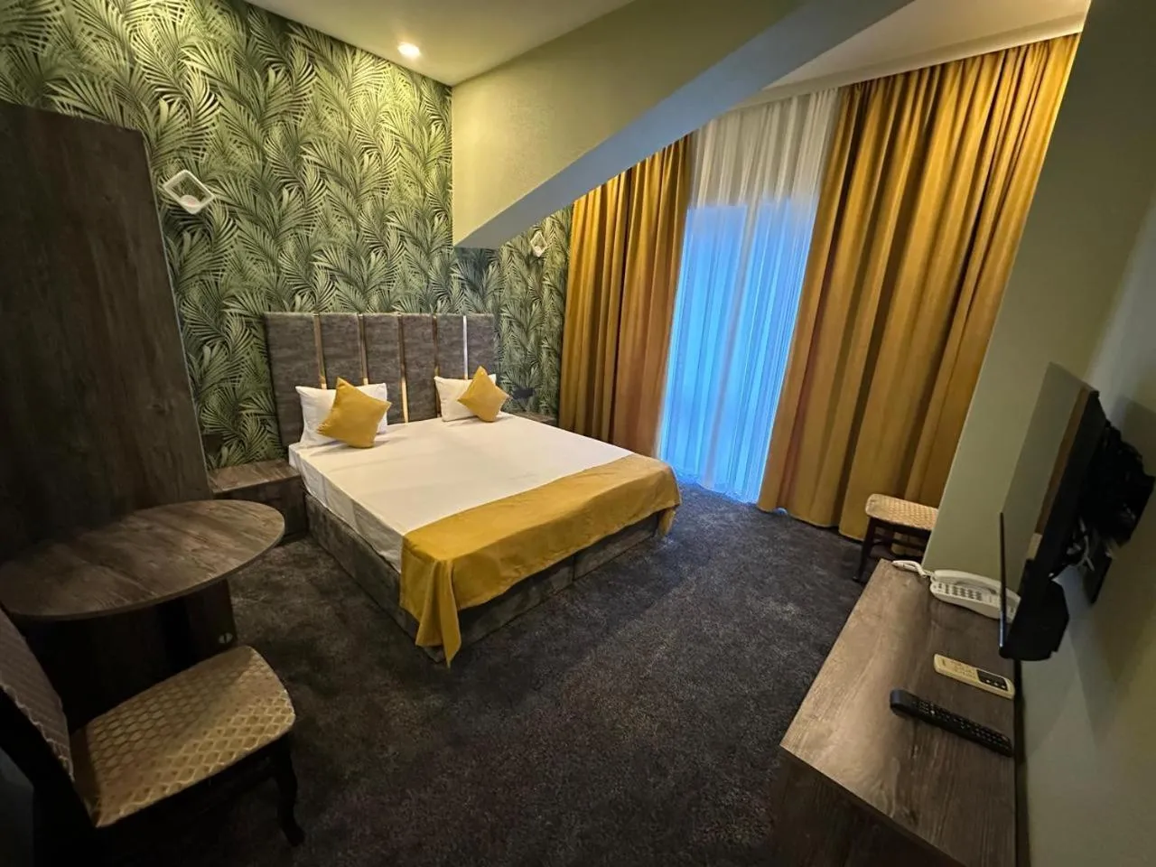 Communal lounge/ TV room, Bed in Sunrise Hotel Baku