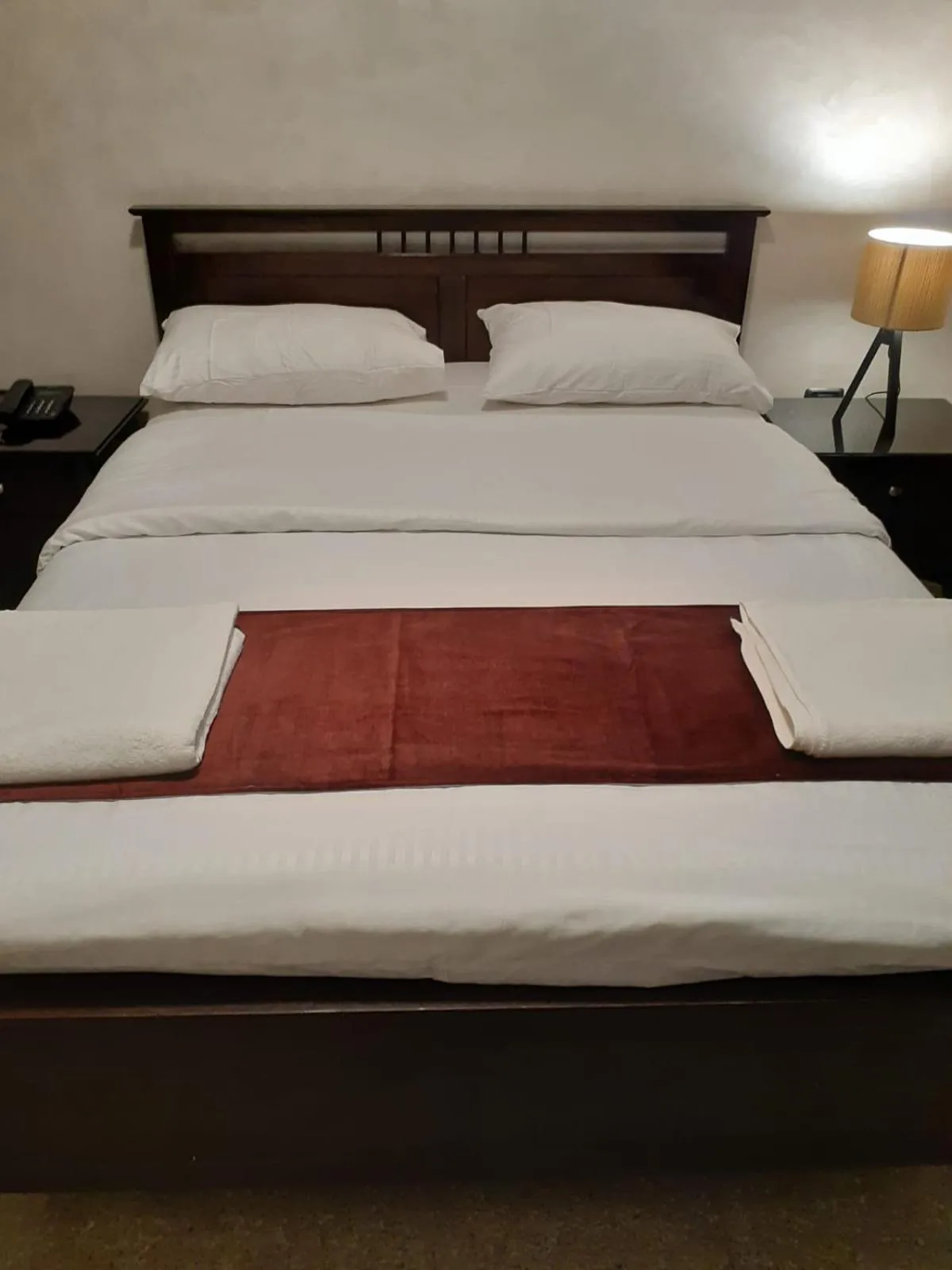 Bed in Tamrah Suites Hotel