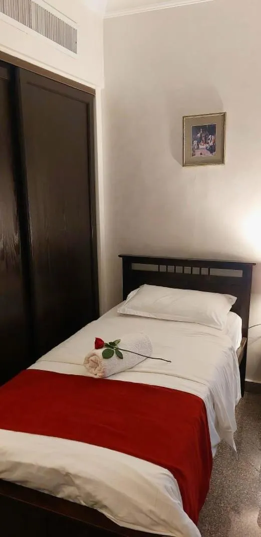 Bed in Tamrah Suites Hotel