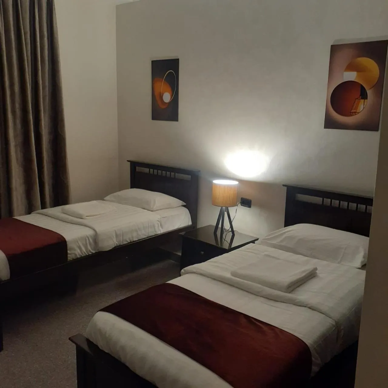 Bed in Tamrah Suites Hotel