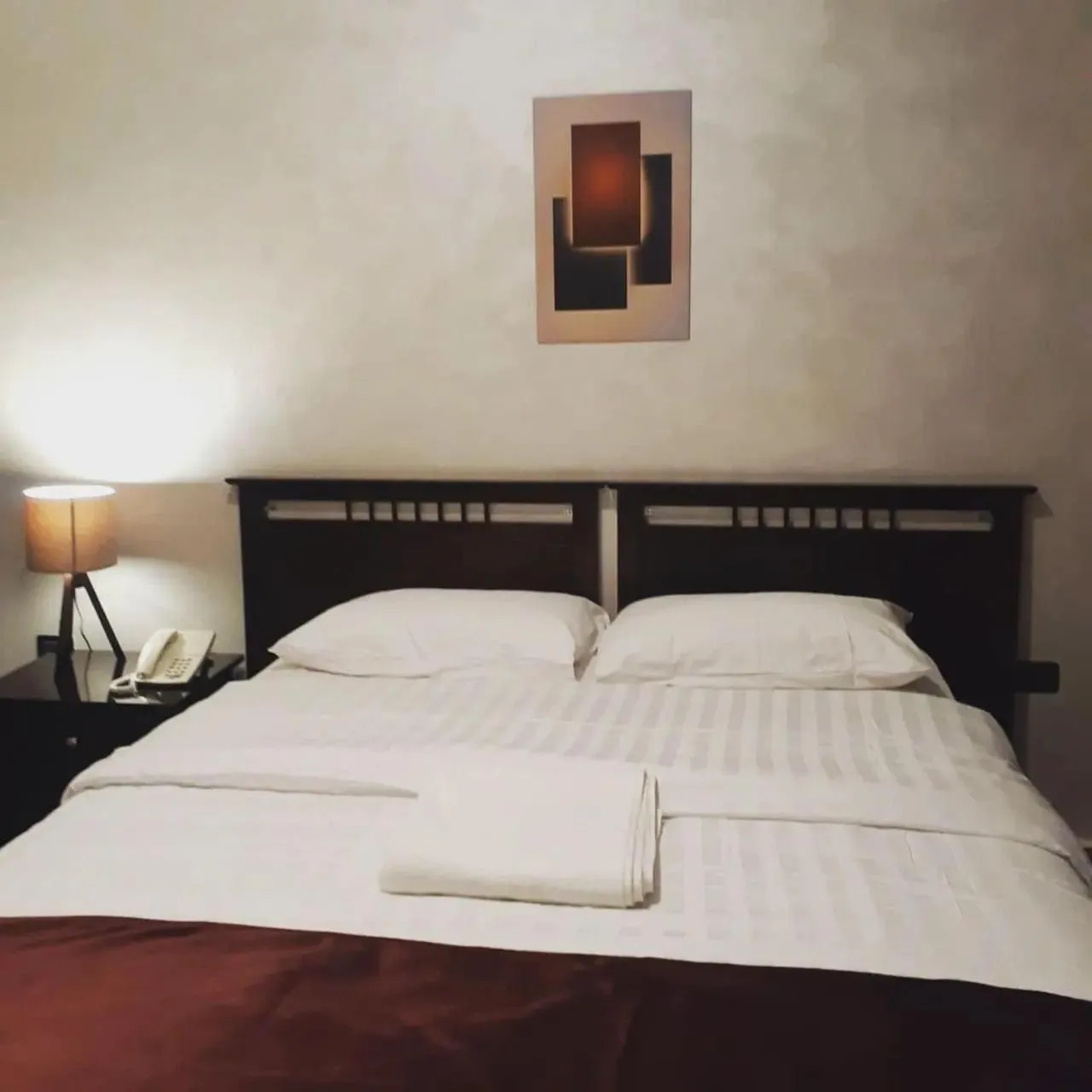 Bed in Tamrah Suites Hotel