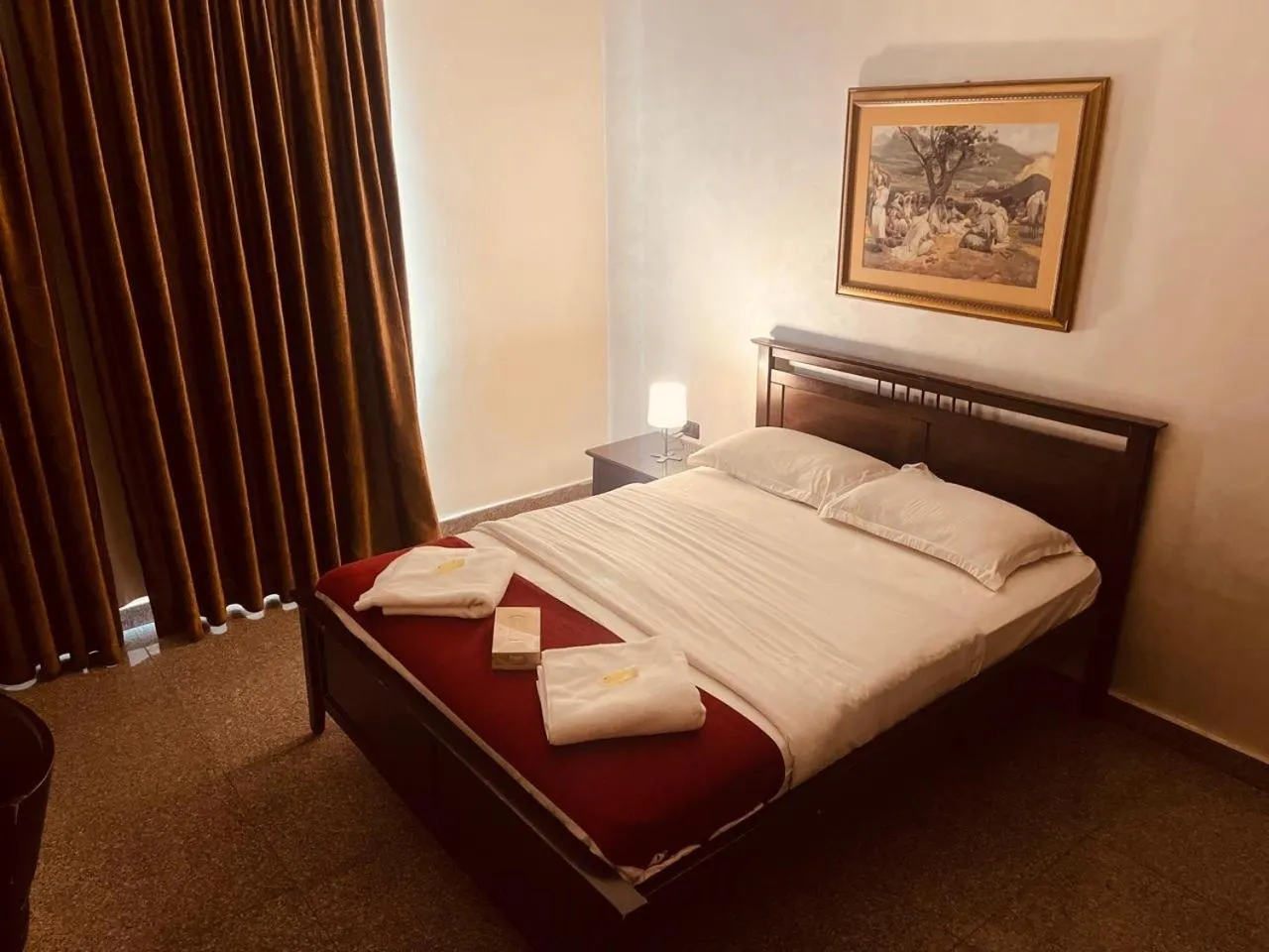 Bed in Tamrah Suites Hotel