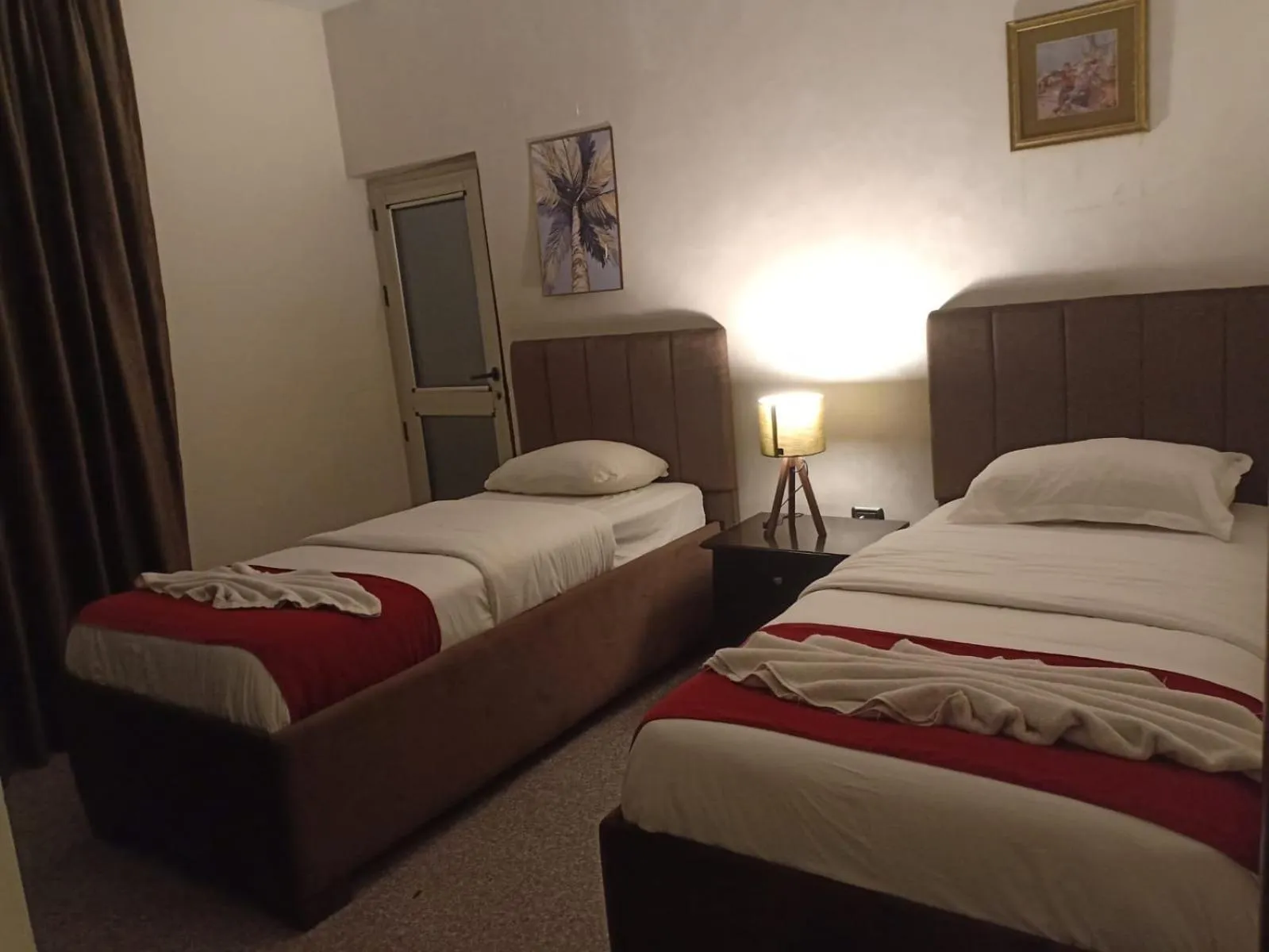 Bed in Tamrah Suites Hotel