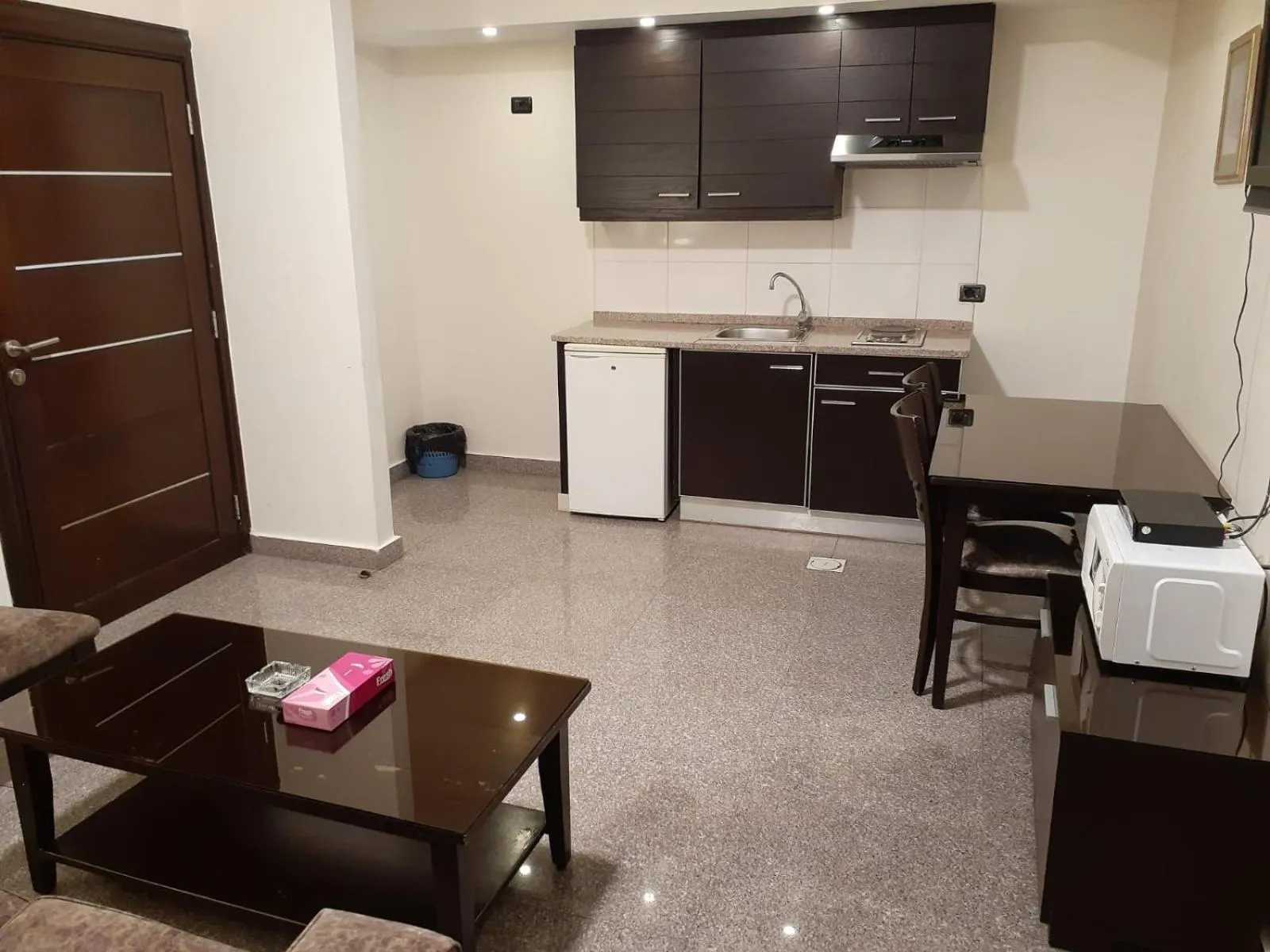 Kitchen or kitchenette in Tamrah Suites Hotel