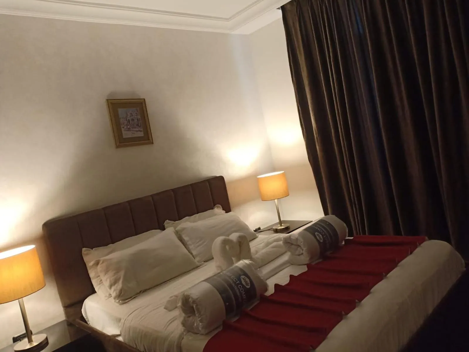 Bed in Tamrah Suites Hotel