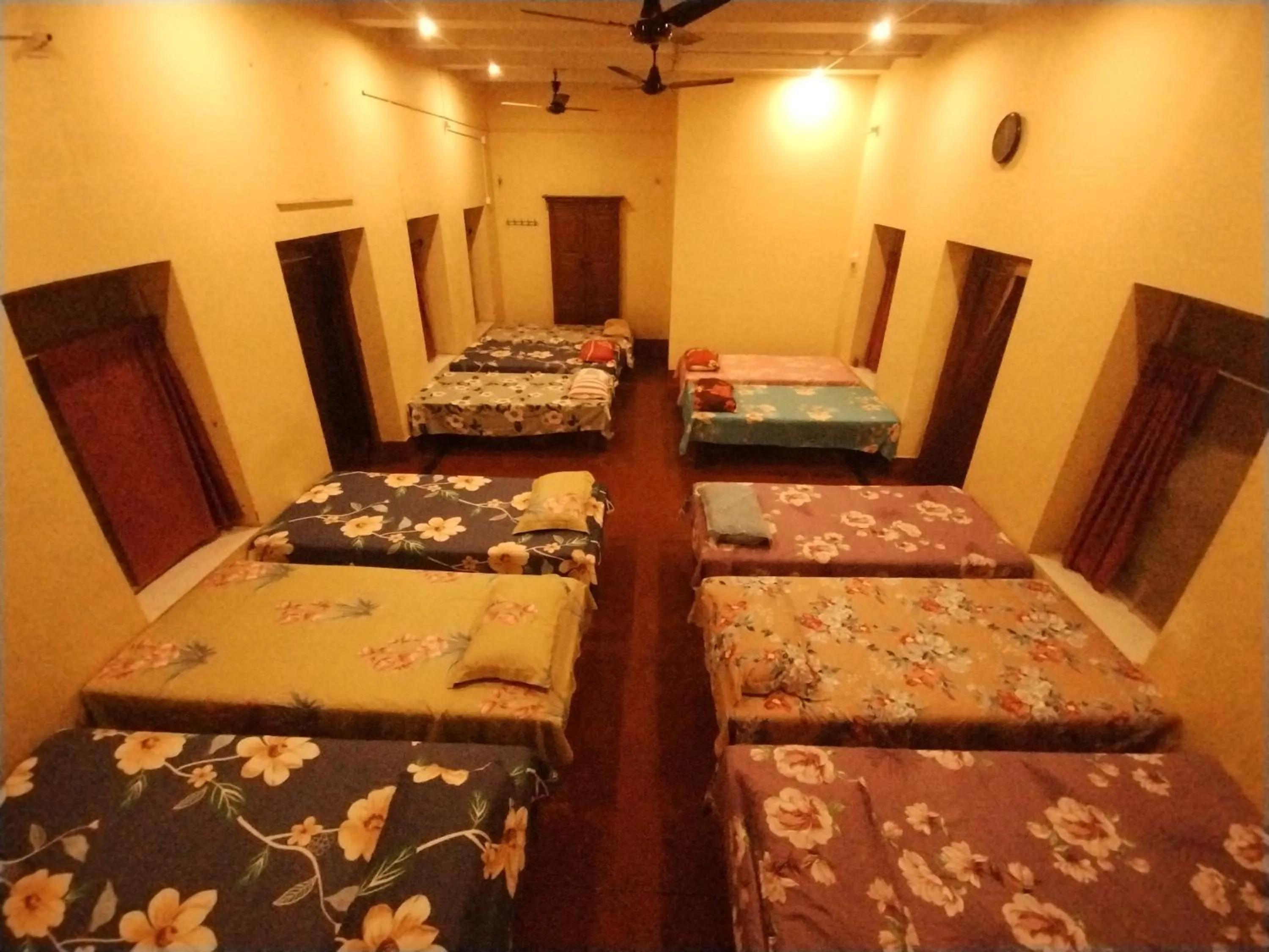 Photo of the whole room, Bed in Bequest Stays In Puri