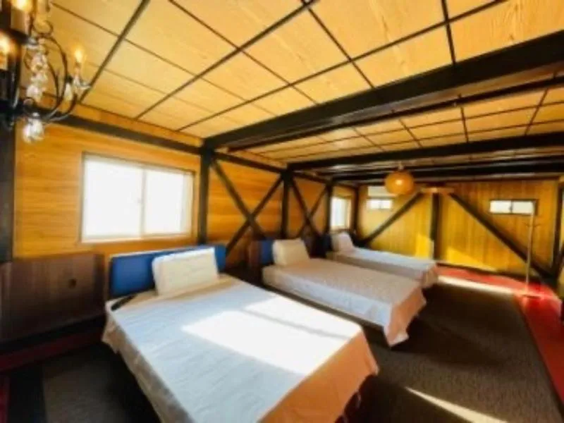 Bed in HOTEL COCOA RESORT