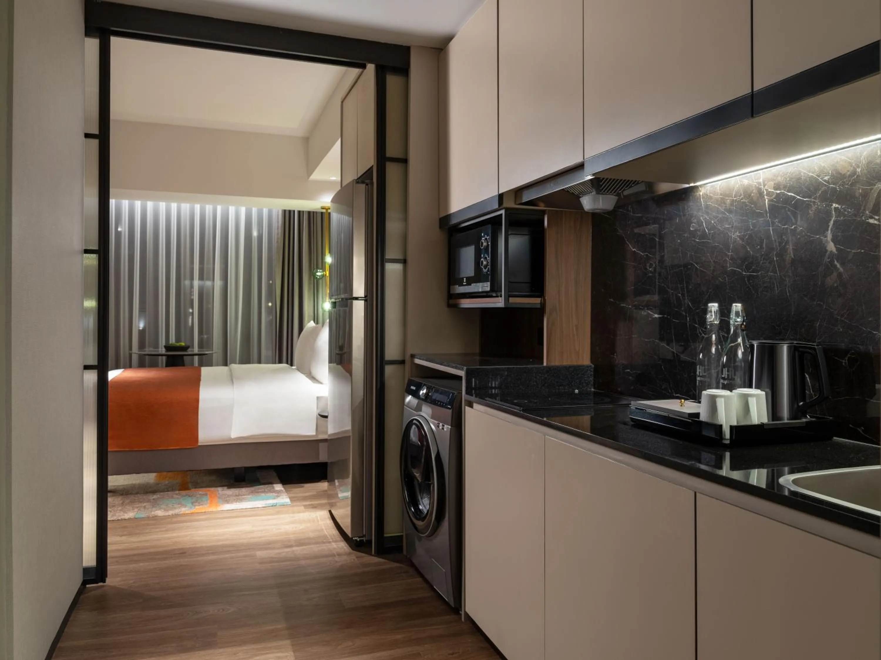 Kitchen or kitchenette, Bed in Herloom Hotel & Residence BSD Tangerang