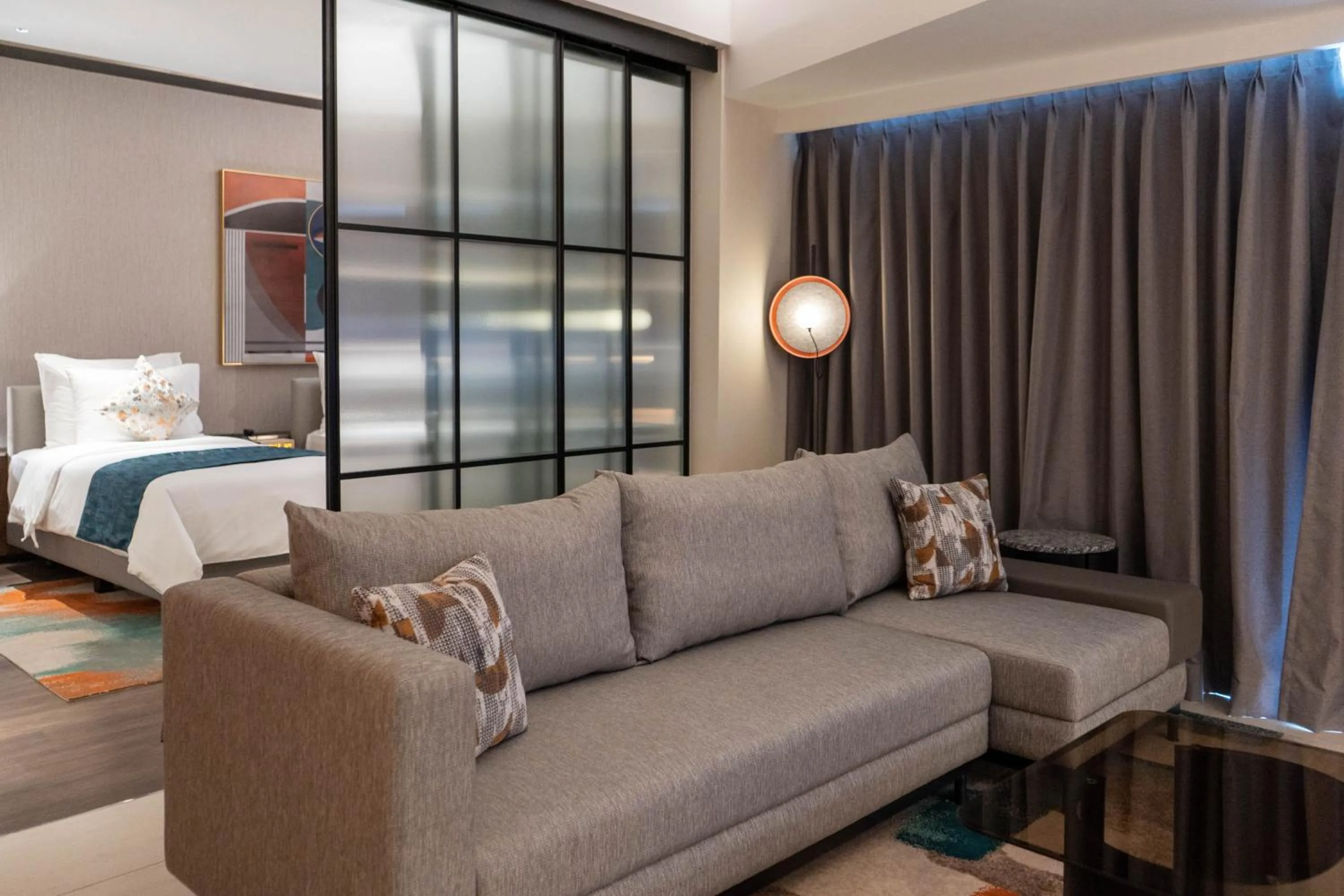 Seating area, Bed in Herloom Hotel & Residence BSD Tangerang