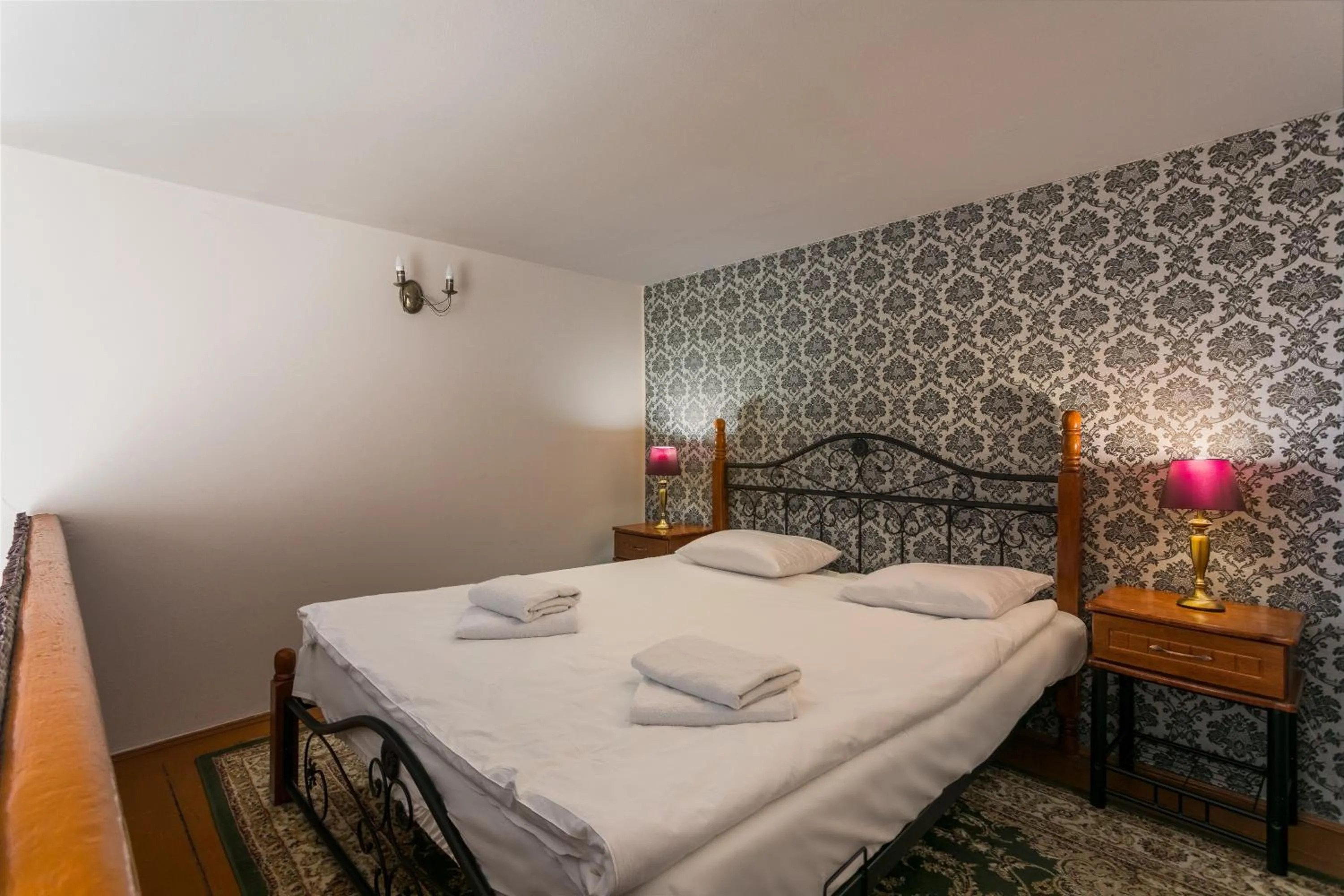 Bed in The Spiski Palace Apartments
