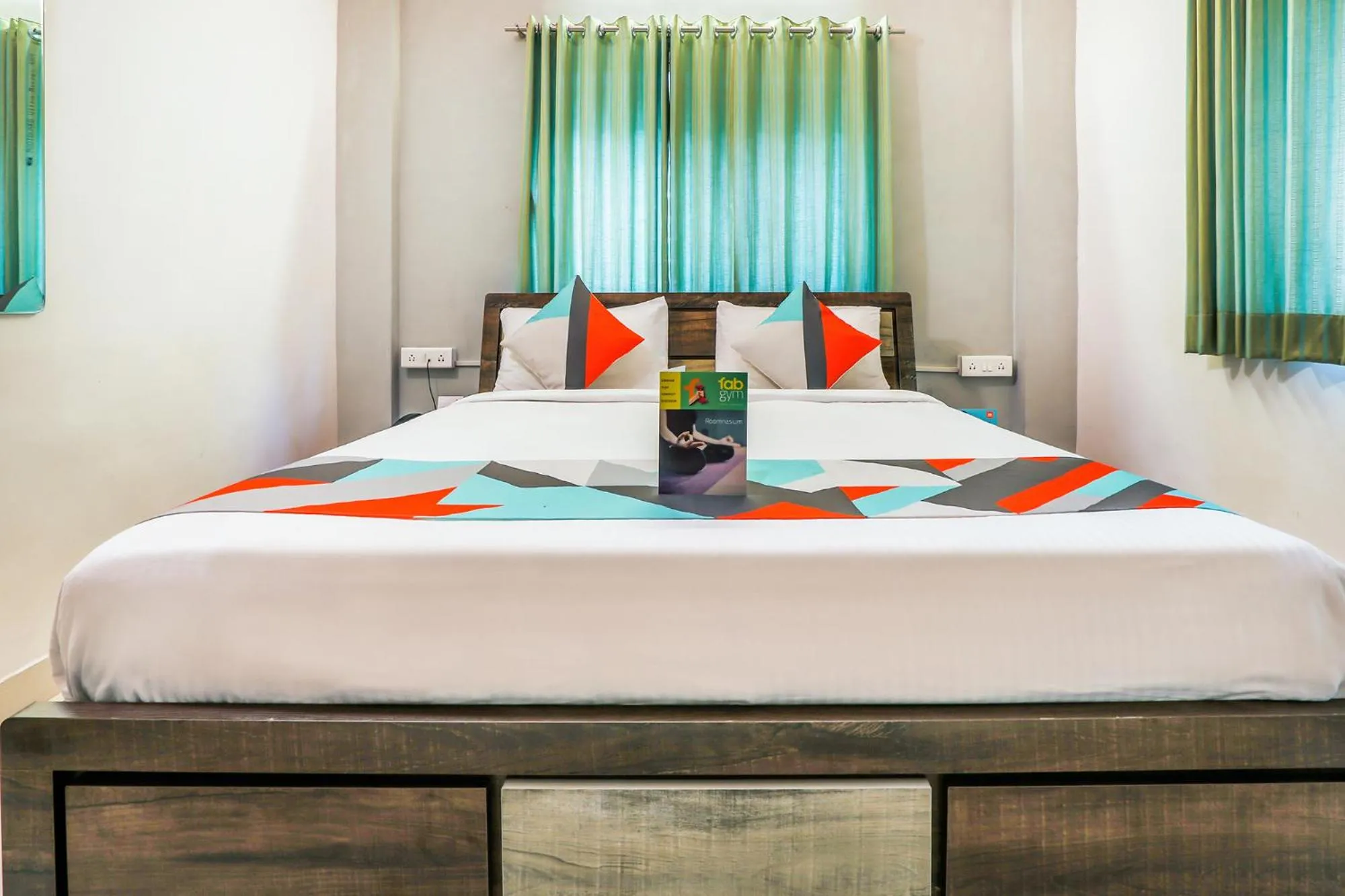 Photo of the whole room, Bed in FabExpress Diamond Residency - Airport road