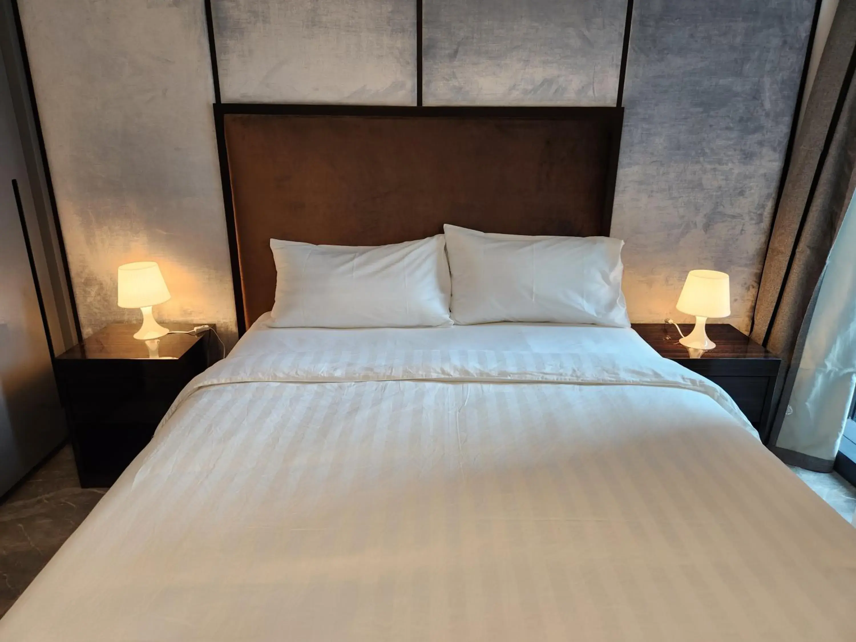 Bed in The Platinum 2 Premium Suite by Reluxe Bed in The Platinum 2 Premium Suite by Reluxe