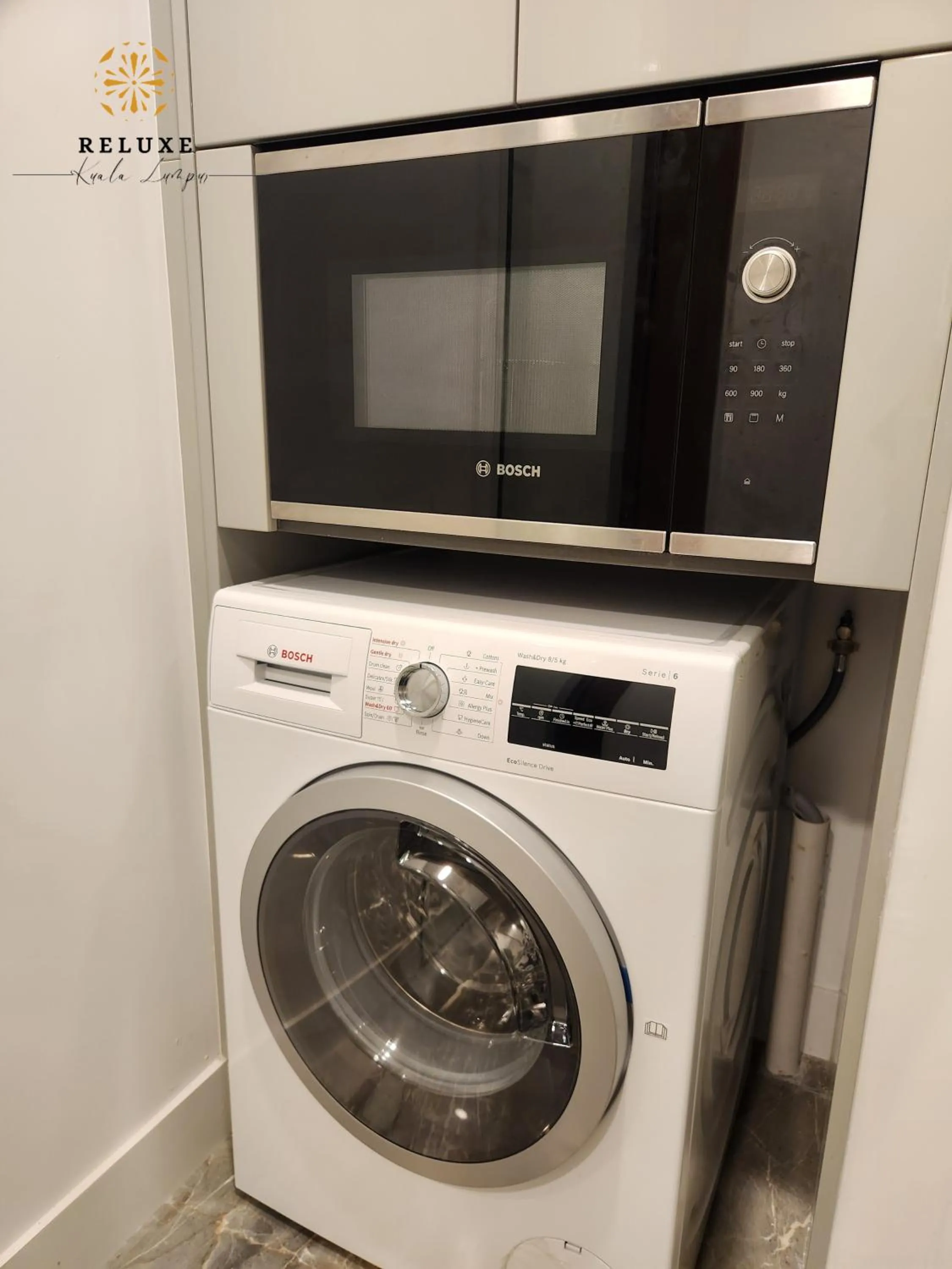 washing machine in The Platinum 2 Premium Suite by Reluxe