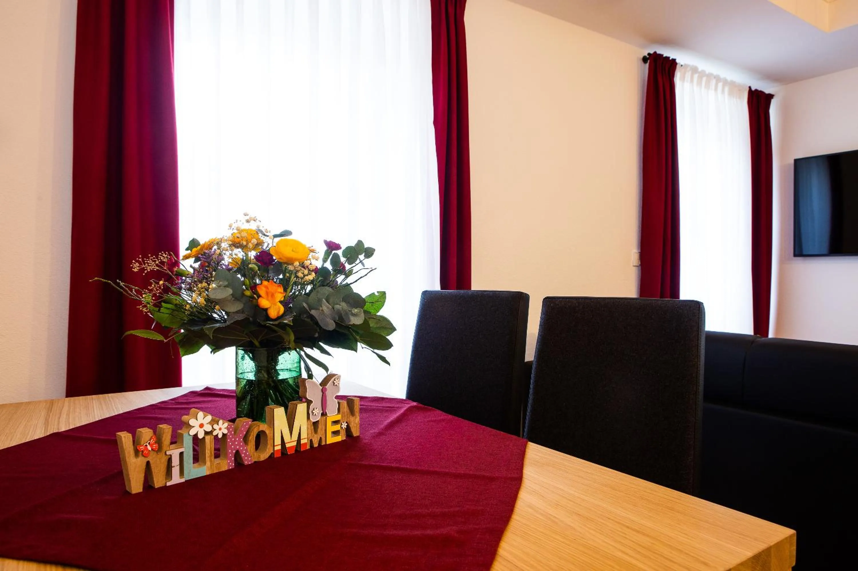 Communal lounge/ TV room in Gasthof & Hotel Bichler