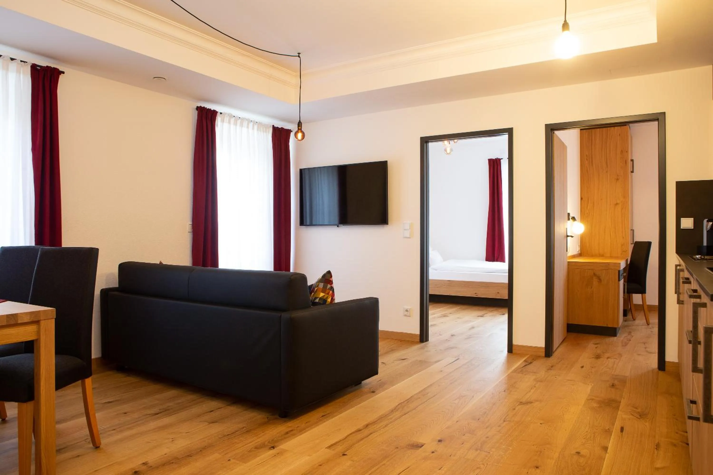 Communal lounge/ TV room in Gasthof & Hotel Bichler