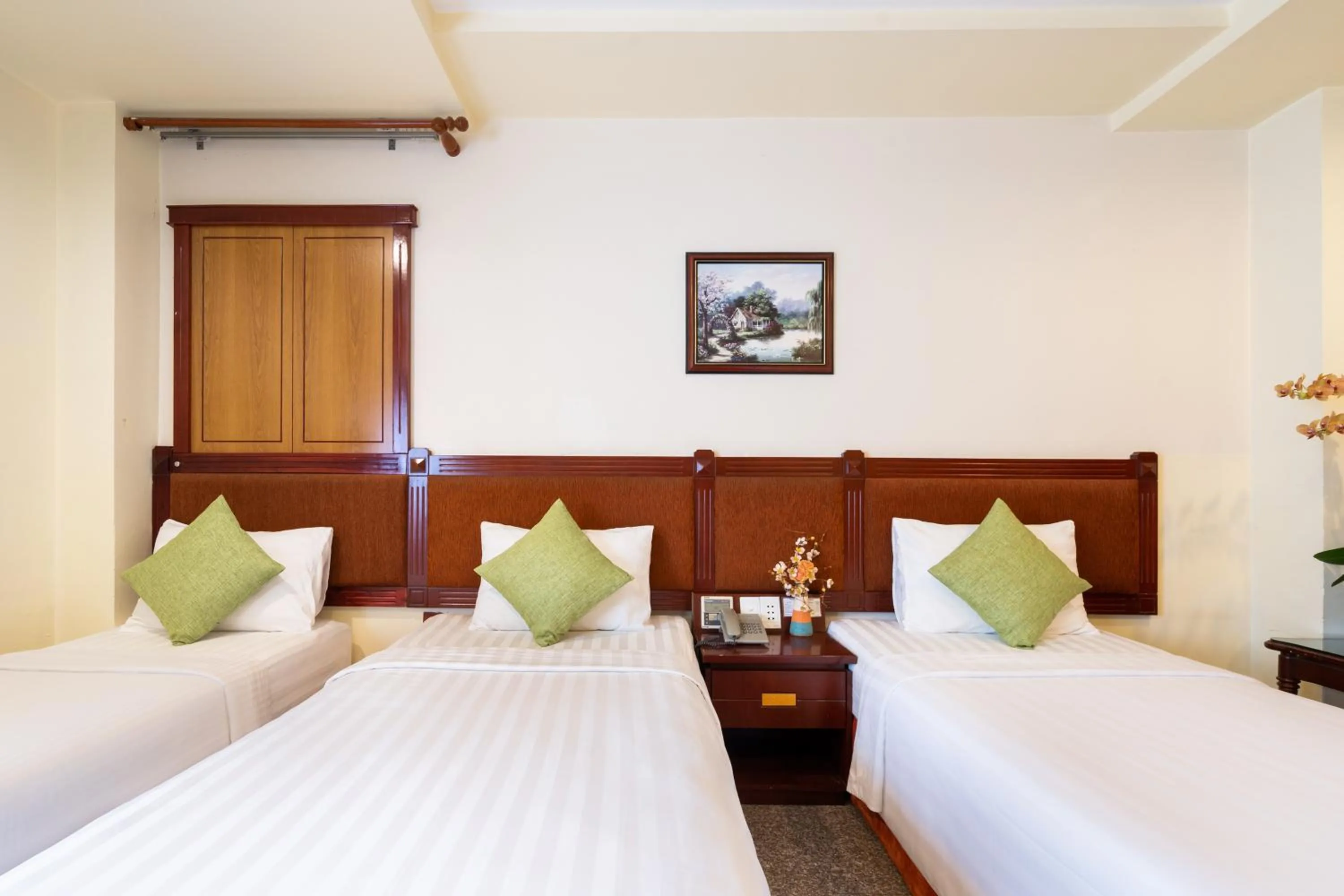 Bed in LUCASTA SAIGON Hotel